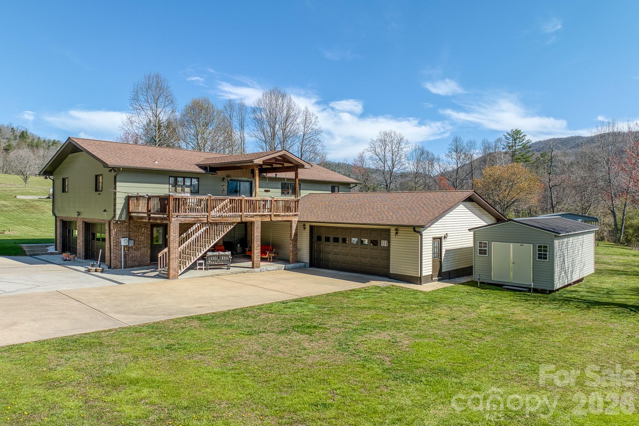 Ultimate Adventure Hub in Pisgah Forest – Adjacent to the Ecusta Trail!
Multi-Asset Value: Main residence + 2 additional parcels + income-producing double-wide.

Key Features:
Ecusta Trail Access: Extraordinary proximity for cycling and walking.
Minutes to the Forest: Short drives to both Pisgah and DuPont trailheads.
Microfarm Ready: Level, usable land perfect for homesteading and sustainability.
Unrestricted Living: Total freedom with no restrictive covenants or HOAs.
Commuter Friendly: Easy access to the amenities of Brevard while maintaining a private, rural feel.

Discover the perfect blend of mountain convenience and homesteading potential at 2456 Hendersonville Highway. This unique property is a true outdoor enthusiast’s sanctuary, offering a rare combination of unrestricted freedom, potential income, and an unbeatable location at the gateway to Western North Carolina’s most iconic recreation.

Prime Location & Unrivaled Trail Access
Positioned perfectly between Pisgah National Forest and DuPont State Recreational Forest, this home is an adventurer's dream. Most notably, the property sits directly adjacent to the Ecusta Trail, providing extraordinary, immediate access to one of the region's premier biking and walking paths right from your own backyard. Whether you’re a mountain biker looking for a basecamp or a nature lover seeking a scenic stroll, the location is truly world-class.

The Residence & Microfarm
The main home features a spacious and functional layout, offering a comfortable retreat after a day in the forest. Step outside to find an established microfarm ready for your vision. The unrestricted residential zoning means no HOAs—giving you the freedom to expand your gardens, keep animals, or build out the ultimate mountain biker’s retreat.

Additional Parcels & Income Potential
This offering includes two additional land parcels, bringing the total acreage to approximately 2.5 acres of opportunity. A double-wide home on the property provides immediate value as a guest house or a consistent rental income stream (estimated at $1,000/month). Whether you maintain it as a "mortgage helper" or utilize the space for a private estate expansion, the flexibility here is unmatched in the Pisgah Forest market.

Experience the best of the mountain lifestyle with a property that pays for itself and puts the best of WNC trails at your doorstep. Schedule your tour today to see the incredible potential of this Pisgah Forest gem!
This listing also includes three additional parcels: 9507-74-5214-000, 9507-74-6355-000, 9507-74-5438-000

Foundation: Footers Based on the attached floor plan, the total interior living space is categorized by floor:  The storage unit on the right side of the garage is currently not included in this listing (negotiable). 
Additional Areas: garage (2,299 sq. ft), deck (325 sq. ft), and porch (70 sq. ft).