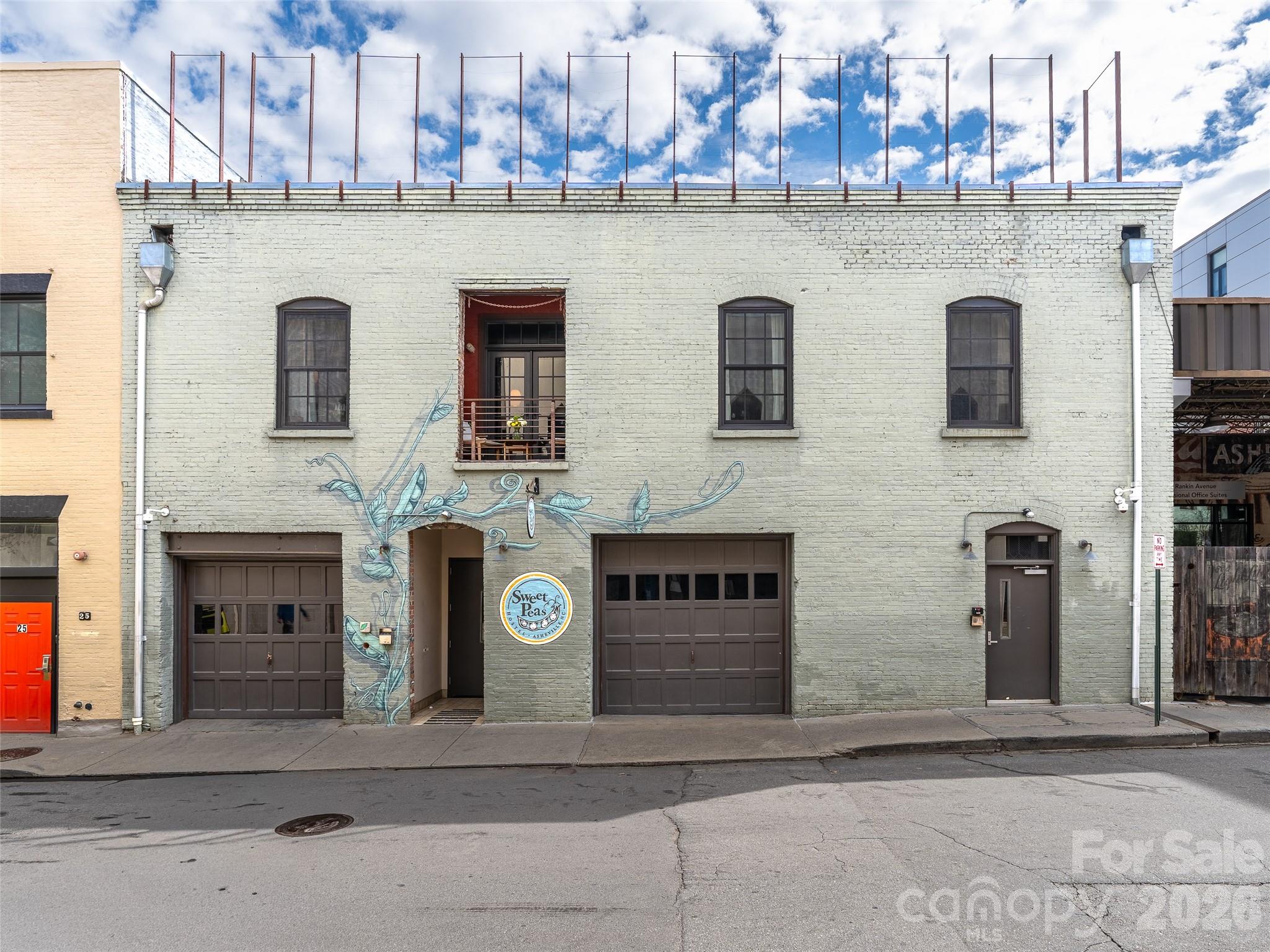 Discover this stunning industrial-modern loft in the heart of downtown Asheville, where historic character and modern design come together with a true sense of place. Located in the iconic T.S. Morrison building, this fully one of a kind residence offers an authentic urban experience just steps from Asheville’s renowned dining, music and art scene. Rich architectural details define the space, including exposed brick walls, Hemlock floors, exposed wood beams, and striking handcrafted metalwork. Soaring ceilings with exposed ductwork enhance the dramatic loft aesthetic, while French doors open to a charming Juliette balcony perched above the European feel of Rankin Ave. Unit 302 is also available, along with several opportunities within this landmark downtown property. Contact listing agent for details.