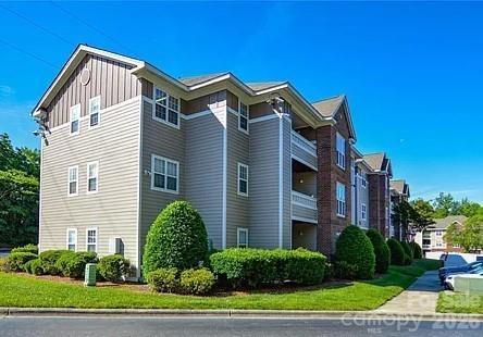 Turnkey modern investment in this bright 3 bedroom, 2 bath condo with an open concept floor plan in gated community within walking distance to UNCC! Kitchen features plenty of counter space & cabinetry for storage, updated flooring & light fixtures! Living Room/Dining Area open with updated flooring & access to covered balcony with storage space! Spacious Primary Bedroom with walk in closet & private bath! Bedroom 2 offers ceiling fan & private balcony access! Bedroom 3 features ceiling fan/light and direct access to 2nd bath! Neutral paint throughout!