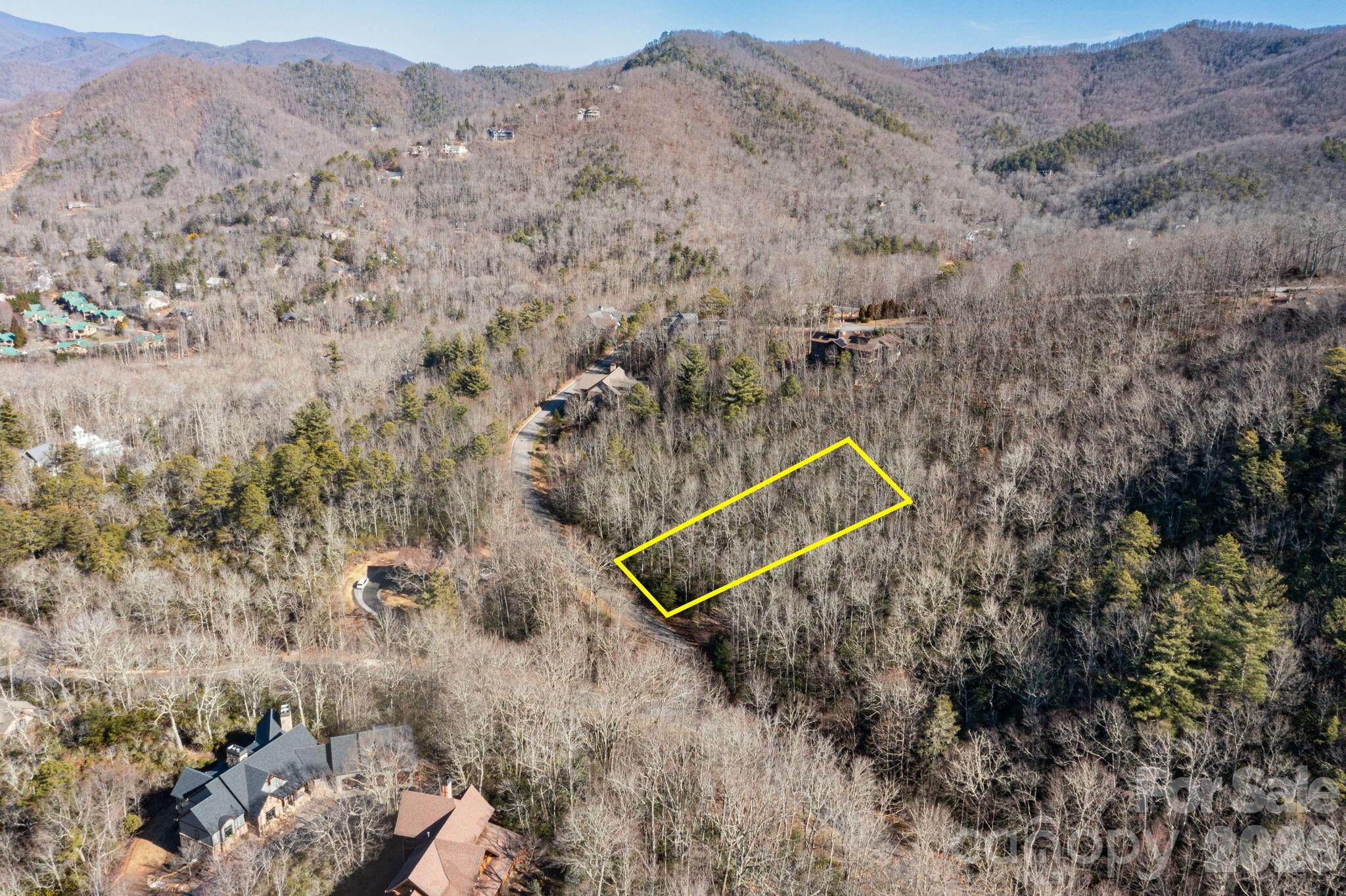 Build your luxury mountain retreat in one of Black Mountain’s most sought-after gated communities. This .55-acre homesite offers west-facing exposure, seasonal mountain views, and a peaceful, private setting—while remaining just minutes from downtown Black Mountain.

The real draw is the lifestyle. The Settings of Black Mountain is known for its scenic walking trails, inviting clubhouse, and refined sense of community, with surrounding homes routinely selling over $1 million. It’s a neighborhood that feels tucked away, yet effortlessly connected.

Adding to the appeal, this lot is served by city water and sewer, making the path to building simpler and more cost-effective than many mountain properties.

A rare opportunity to create a custom home in a high-end, established community where privacy, nature, and convenience come together seamlessly.

Contact the listing agent to schedule a tour and experience The Settings for yourself.