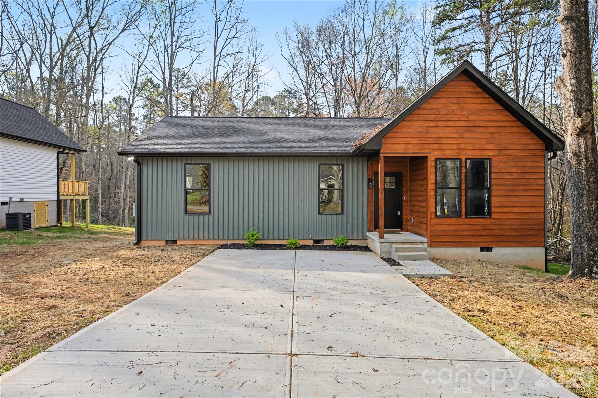 Beautifully crafted new construction home just minutes from downtown Cherryville. This thoughtfully designed property showcases quality craftsmanship throughout, featuring custom accent walls and a bright, open-concept layout.

The stylish kitchen offers a spacious peninsula, modern finishes, and plenty of room for entertaining. The inviting living room is highlighted by a sleek fireplace, creating a warm and welcoming atmosphere.

Enjoy privacy in the backyard along with a deck perfect for relaxing or hosting gatherings. This home combines comfort, style, and convenience in an ideal location.