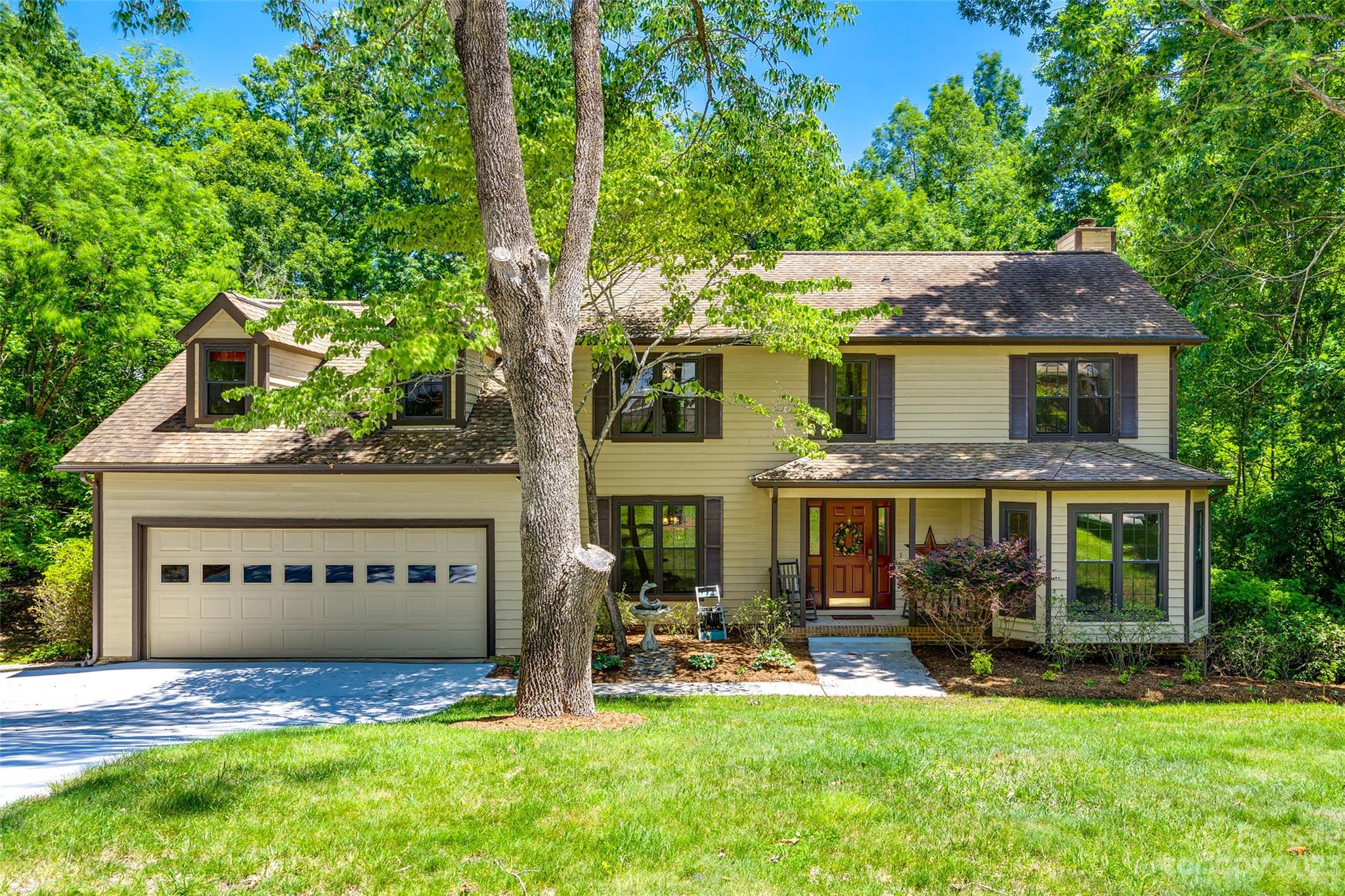 WOW, over 1/2 acre lot in Tega Cay - lots of sqft for the price!! As a resident of Tega Cay, you have access to the marina, boat ramps, & beaches, allowing you to enjoy all the water activities this charming town offers. You'll be greeted by newly installed carpet & fresh paint as soon as you step inside, giving it a fresh & updated feeling. The kitchen remodel features quartz counters. Step outside onto your screened porch or open deck, & take in lush views of the wooded lot. Bed/bonus on upper-level w/private stairway access & a built-in desk for those who need a dedicated workspace at home. A newly paved driveway leads to your two-car garage, providing ample space for vehicles & storage needs. Downstairs is a partially finished basement & stubbed bathroom, waiting for you to bring personal touches to make it truly unique. Community amenities include parks, a golf course, tennis courts, walking trails & more.