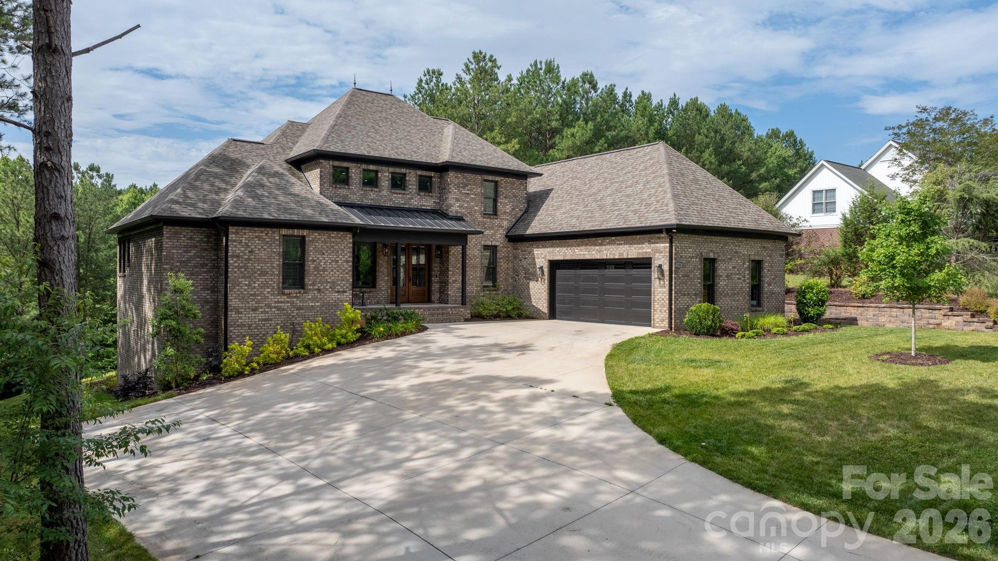 Beautiful custom built 4 Bedroom, 3.5 bath home located in the desirable River Bend community near Lake Hickory. This specious home features an open floor plan with hardwood floors, a large living room with fireplace, a well-appointed kitchen with ample cabinets and counter space, an oversized island, double oven, double range, and an in-law suite on the main floor. The primary suite offers a private retreat with spacious bath and walk-in closet. The home also features 2788 sq ft of unfinished walkout basement with endless possibilities. Enjoy outdoor living on the rear deck overlooking a peaceful wooded setting. Situated on a generous size lot, this property combines privacy, comfort, and convenience with easy access to Lake Hickory, shopping, dining, and major highways. A wonderful opportunity to enjoy quality living in one of the area's most sought-after communities.