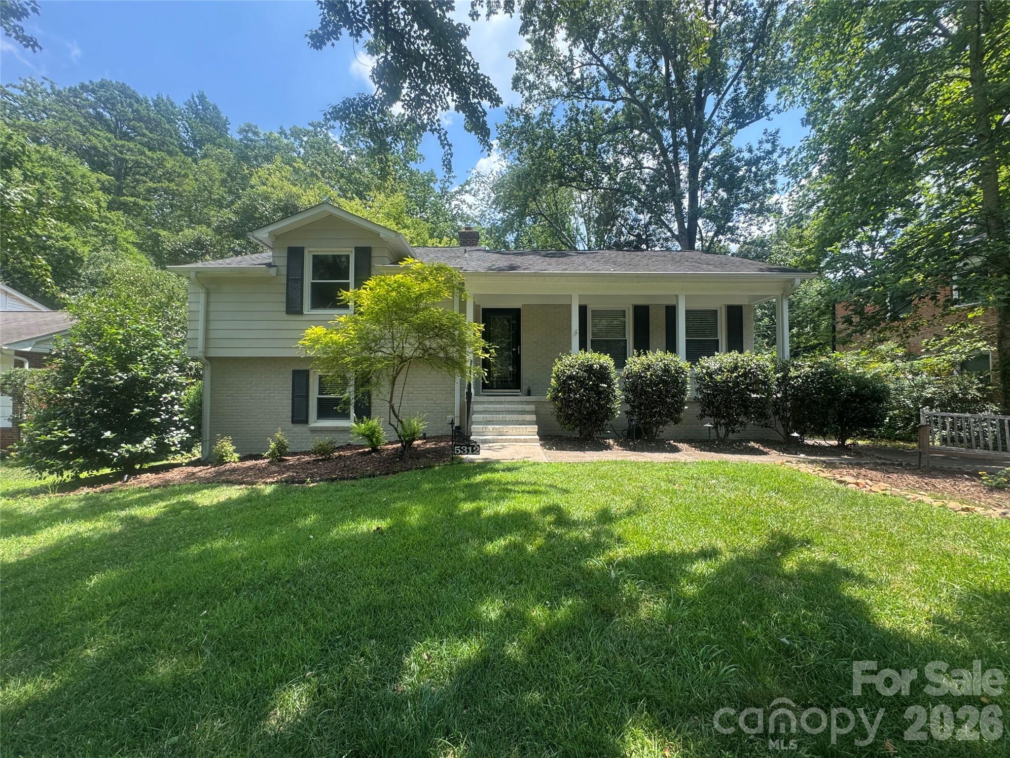 You must see this incredibly charming white painted brick home in popular Madison Park! It has fantastic curb appeal and outstanding upgraded landscaping. A large rear deck overlooks the beautiful, deep and flat back yard which is completely fenced and even the power lines are buried. This special house is move-in ready with fresh neutral paint, refinished hardwoods, custom blinds on each window, updated lighting and doors, and a kitchen with custom cabinets and SS appliances. One of the 4 bedrooms has an exterior door which would be convenient for a home office.