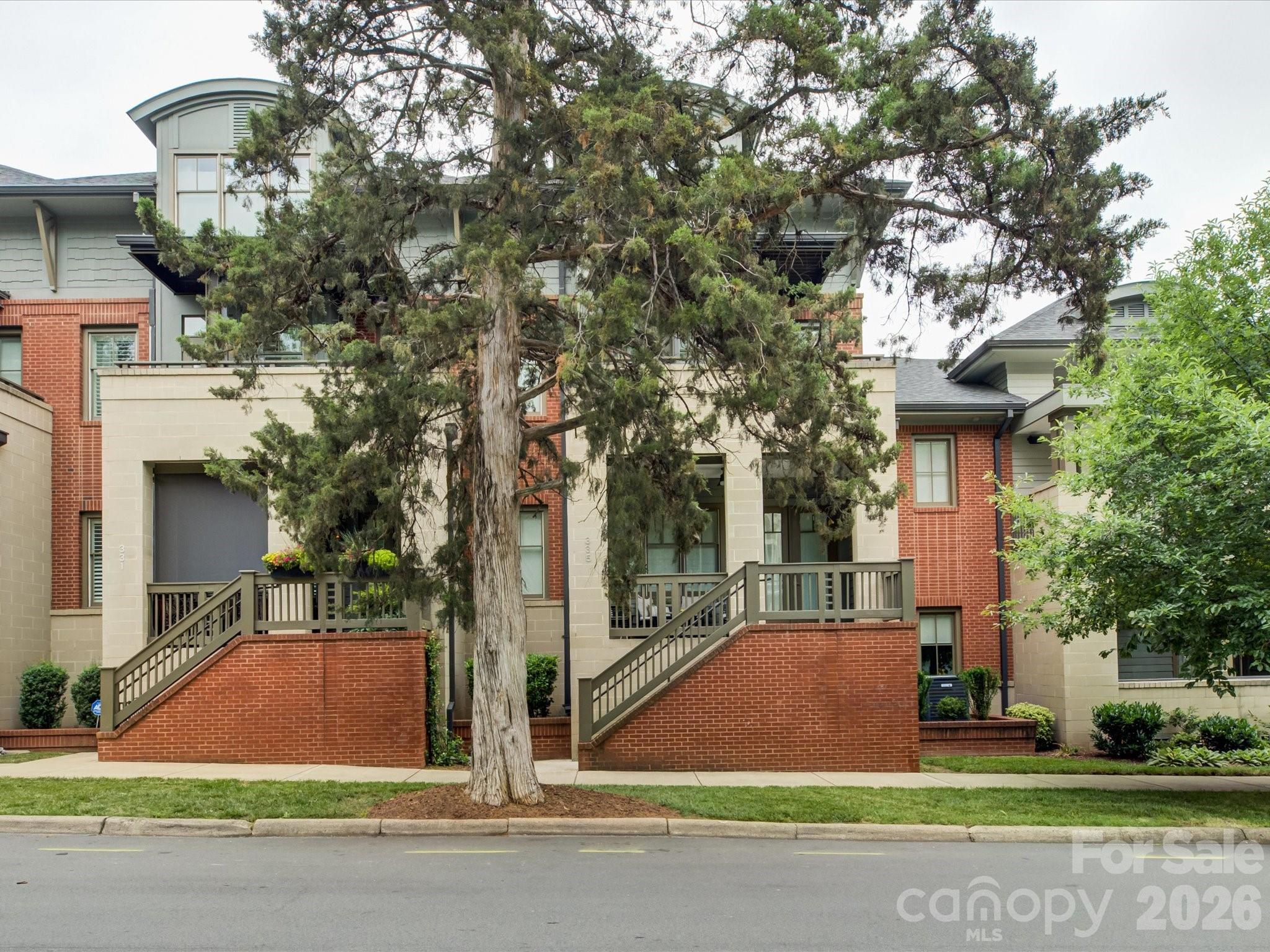 Welcome to the home you've been waiting for in the heart of Dilworth! Perfectly positioned at 335 E. Tremont Avenue, this exceptional residence offers the ultimate blend of luxury convenience, and walkable city living. Just steps from restaurants, pubs, boutiques, and everyday conveniences, you'll love calling this sought-after location home. A charming covered front porch welcomes you and provides the perfect setting for morning coffee, evening  cocktails, or relaxing with a good book. Inside, the open-concept main level is designed for effortless entertaining, featuring spacious living areas that flow seamlessly together. The second-floor owner's retreat is a private sanctuary, complete with its own balcony, dual closets...one walk-in closet with organizer, and a spa-inspired ensuite bath featuring a garden tub and separate shower. A versatile flex space on this level offers endless possibilities as a home office, nursery, library, or sitting room. The third floor features two generously sized bedrooms with walk in closets and a full bath, providing plenty of space for family and guests. On the lower level, a finished basement creates the ideal media room, fitness area, or recreation space. Adding to the home's exceptional functionality, a private elevator provides convenient access to every level.  Combining timeless appeal, flexible living spaces, and an unbeatable Dilworth location, this is a rare opportunity to enjoy one of Charlotte's most desirable neighborhoods at its finest. Freshly painted (May 2026). Secondary Bedrooms and basement flex space carpet will be replaced.