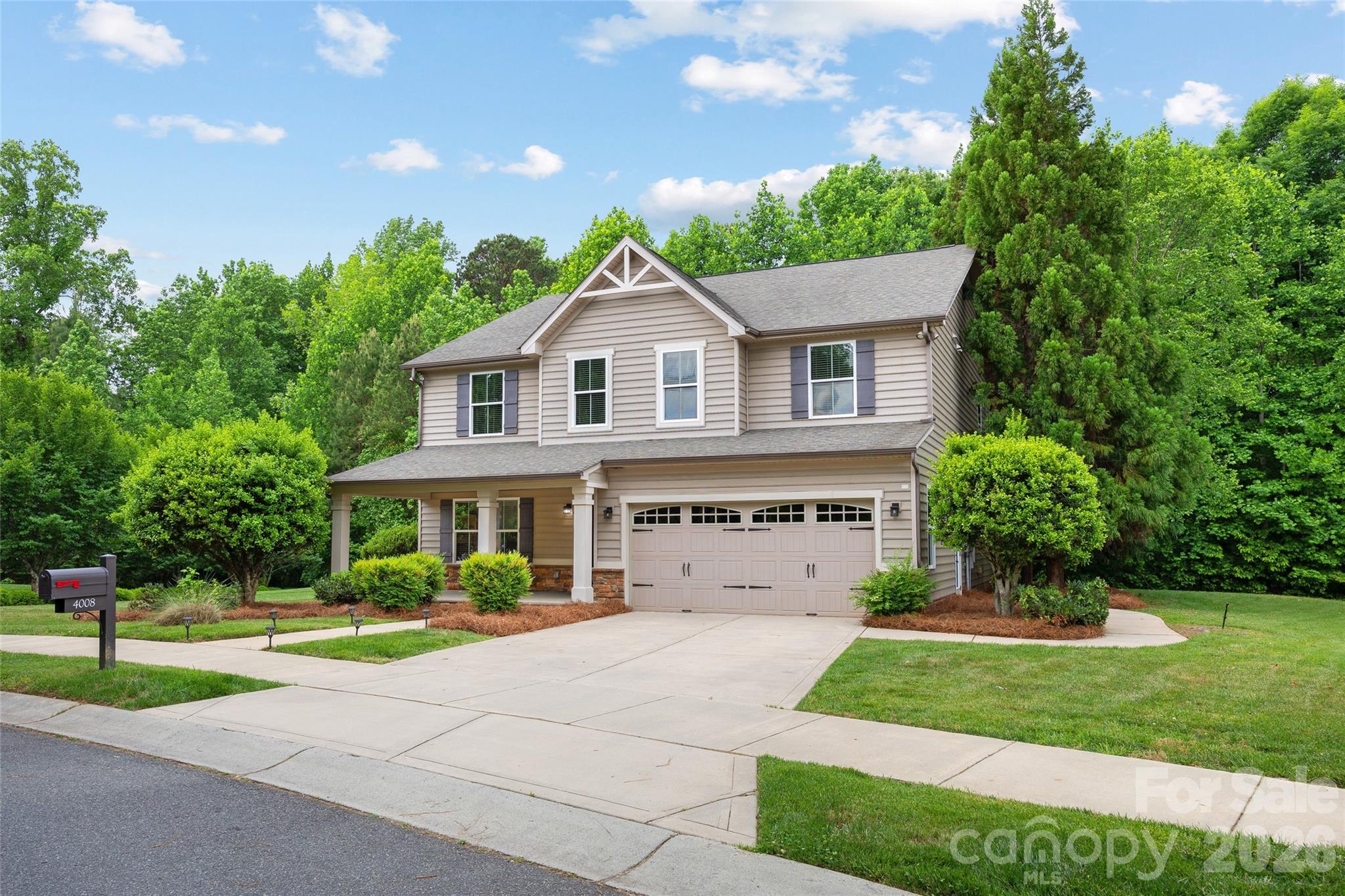 Premier location in the sought-after Millbridge community.  This former model home sits on a .37-acre lot overlooking a mature natural area creating true privacy.  Hardwood flooring extends from the entry through the kitchen and oversized breakfast area. Kitchen is well-appointed with an expanded island, granite, stainless steel appliances, walk-in pantry and abundant storage.  The main level features a formal dining room, a versatile living room or office, a spacious great room with gas logs and an additional flex room.  Brand new LVP flooring enhances the primary suite and loft/bonus area.  The primary bathroom includes dual vanities, a water closet, soaking tub, separate shower and attached walk-in closet.  The upper level also includes three additional bedrooms, two full baths and a conveniently located laundry room.  Enjoy outdoor living on the rear patio, complete with in-ground irrigation and a two-car garage with a service door.  Millbridge offers resort style amenities unlike any other.  Buyers, would you or your family like to just cross the street and access the clubhouse, outdoor pool with lazy river and splash pad, movie theater, fitness center, café, covered sport court and scenic walking trails?  This is the home for you!  Ideally located near shopping, dining and downtown Waxhaw.  Brand new carpet on staircase, Kitchen refrigerator to convey.