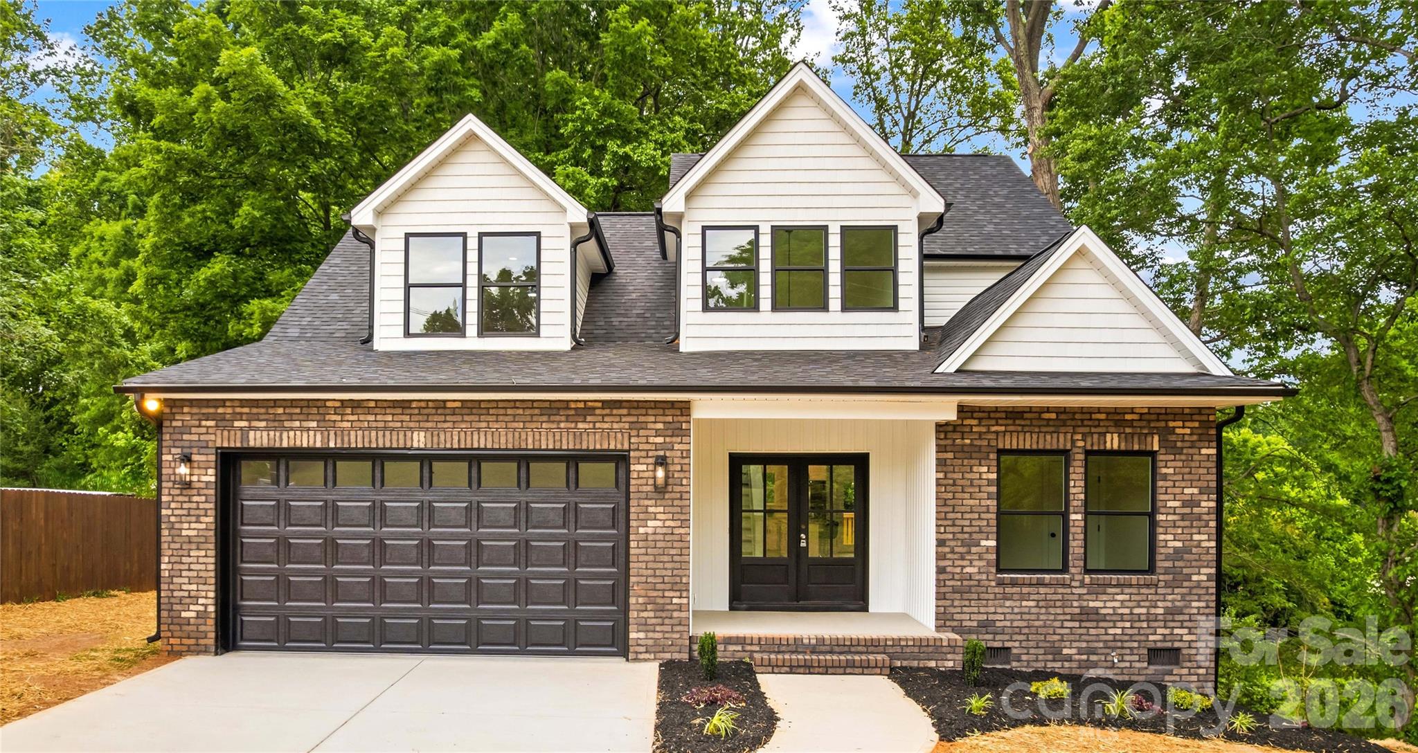 Home is now complete. Custom Modern Farmhouse with Craftsman influences tucked on a quiet street. This beautifully designed home offers a bright, open floor plan ideal for both everyday living & elegant entertaining. Featuring 5 spacious bedrooms plus a bonus room/office. The layout provides exceptional flexibility for modern lifestyles. At the heart of the home is a stunning gourmet kitchen with an oversized quartz island, stainless steel appliances, tile backsplash, and pantry—perfect for gathering and entertaining. The spacious Den filled with natural light & luxury LVP flooring creates a warm yet sophisticated living space. Throughout the home find luxury LVP flooring, & stylish tile finishes that add both beauty and durability. Step outside to 250 square feet of Deck space, ideal for outdoor dining, relaxing, or entertaining guests. The main-level primary suite offers a private retreat with His & Her closets and spa-like comfort in the main bath with walk-in tiled shower & dual vanities. A 2-car garage with double driveway provides ample parking and storage, while the welcoming covered front porch adds classic charm. Crawlspace has an area for extra storage. The drop zone when you walk in from the garage is a great feature. Yard is deep in the back and goes into the woods. Builder feels would have enough room to add a pool. (Please onfirm with county.) Located in the quaint town of China Grove, just minutes to Highways 150, 152, I-85, & 29, and conveniently positioned between Kannapolis, Concord, and Mooresville. Enjoy nearby parks, the Y with indoor pool & fitness facilities, and The Warrior Golf Course just 5 minutes away. Downtown China Grove in 3 minutes with local restaurants, brewery & shops. Wonderful schools with China Grove Elementary, China Grove Middle & South Rowan High. Designed for gathering, entertaining, and comfortable luxury living, this exceptional home truly stands apart. (This home is partially staged & also virtually staged.)