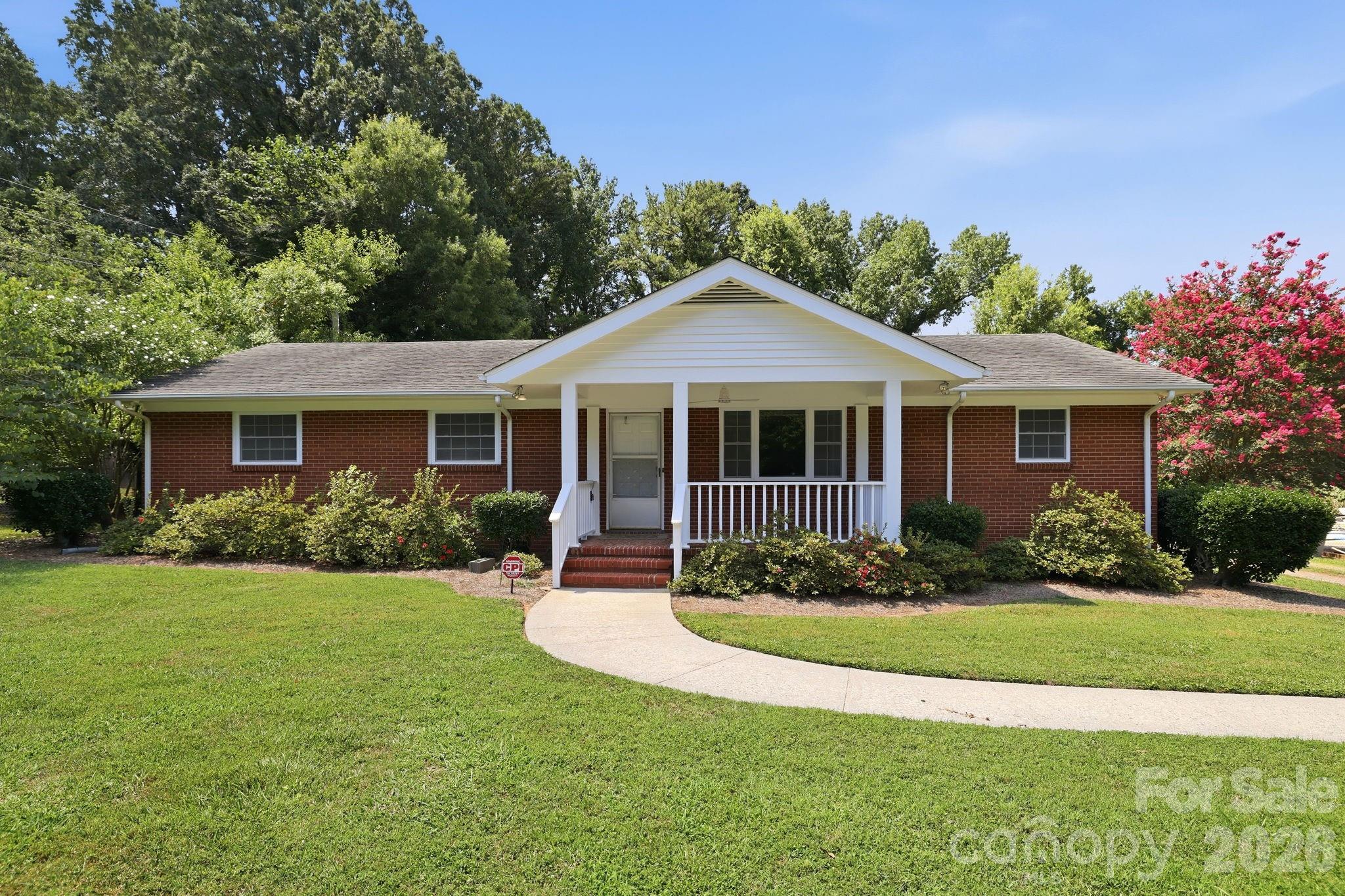 Welcome home to this charming 3-bedroom, 2-bath ranch situated on a beautiful half-acre level lot with no HOA! From the welcoming covered front porch to the spacious backyard, this property offers a wonderful combination of character, recent updates, and outdoor space.

Inside, the single-level floor plan features true hardwood floors throughout the living room and bedrooms, new kitchen flooring, newer carpet, and updated light fixtures. Major improvements have already been completed, including a 1-year-old heat pump and windows replaced approximately 5 years ago, providing added value and peace of mind.

Outside, the expansive, level lot provides plenty of usable outdoor space for gardening, entertaining, or enjoying the outdoors. The covered front porch adds to the home's inviting curb appeal and offers a comfortable spot to relax.

Combining classic ranch charm with thoughtful updates and a spacious half-acre lot, this property presents a wonderful opportunity to make it your own.