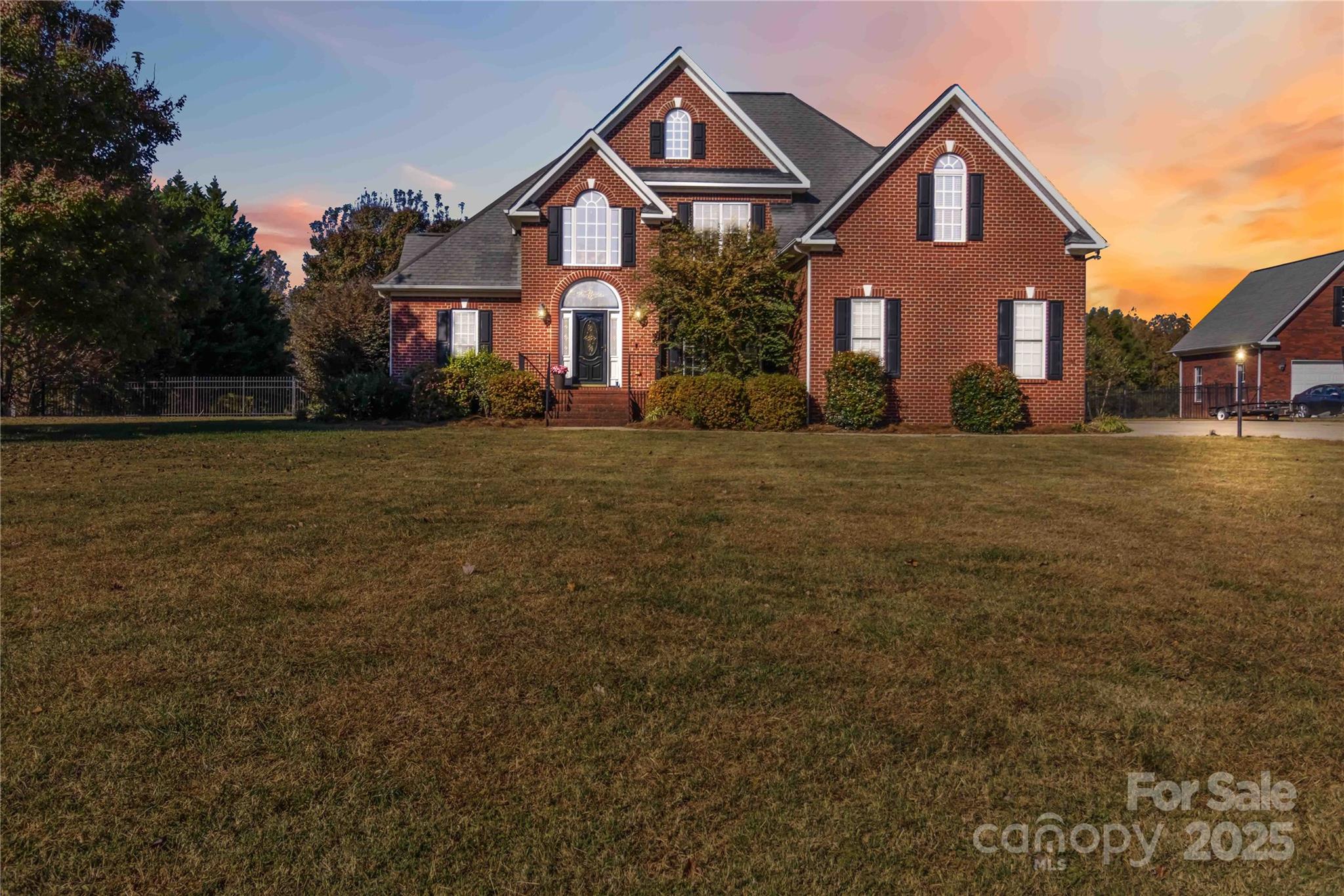 Discover timeless charm and modern comfort in this impressive brick home, perfectly situated on just over 1.3 acres. Enjoy the peace of a country-style setting with the convenience of nearby shopping, dining, local markets, and the Country Club—all with no HOA restrictions.

Inside, nearly 2,900 sq. ft. of well-designed space offers 4 bedrooms and 3 full baths, plus a versatile bonus room that could easily serve as a fifth bedroom, home office, or hobby space. The inviting entryway opens to a formal dining room and a spacious great room featuring soaring ceilings and a cozy fireplace. Beautiful hardwood floors and abundant natural light flow throughout the main level, with tile in the kitchen and baths for easy care.

The primary suite provides a comfortable retreat with a private bath that includes dual vanities, a step-in shower, and a relaxing soaking tub.

Step outside to enjoy the fenced backyard, a patio ideal for outdoor gatherings, and a two-car garage for convenience.

Experience the best of comfort, space, and location—all in one remarkable property.