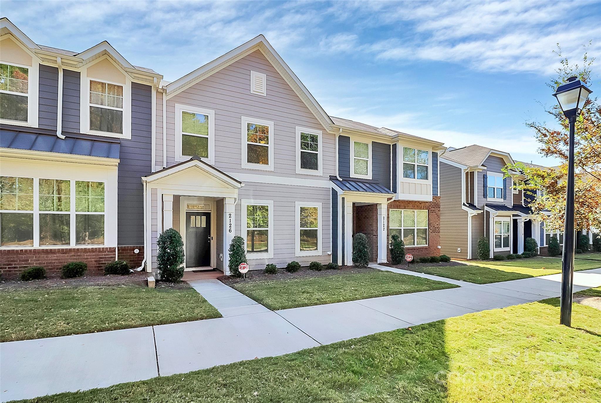 Like new townhome in the Davis Lake community! Live close to it all in this stunning 3 bed/2.5 bath home.  As you pull up to the home, notice the privacy from the wooded area across the street. As you walk in, prepare to be amazed at how well kept this home is.  The large living room is bright and leads into the cook's kitchen complete with lots granite cover the island and extensive cabinetry all highlighted by stainless steel appliances. Across the kitchen is the built in desk area and storage.  Entertain guests in the large dining area overlooking the private patio.  Upstairs you will find two great sized bedrooms that share a bath, the laundry area and then the primary suite at the end of the hall. This luxurious owner's retreat has it all...an amazing bath complete with double vanity and large shower. The walk in closet is an added touch to the peaceful retreat! All of this and more just minutes to shopping, dining, W.T. Harris Blvd, I-77, 485, Northlake Mall and 15 min to Uptown!