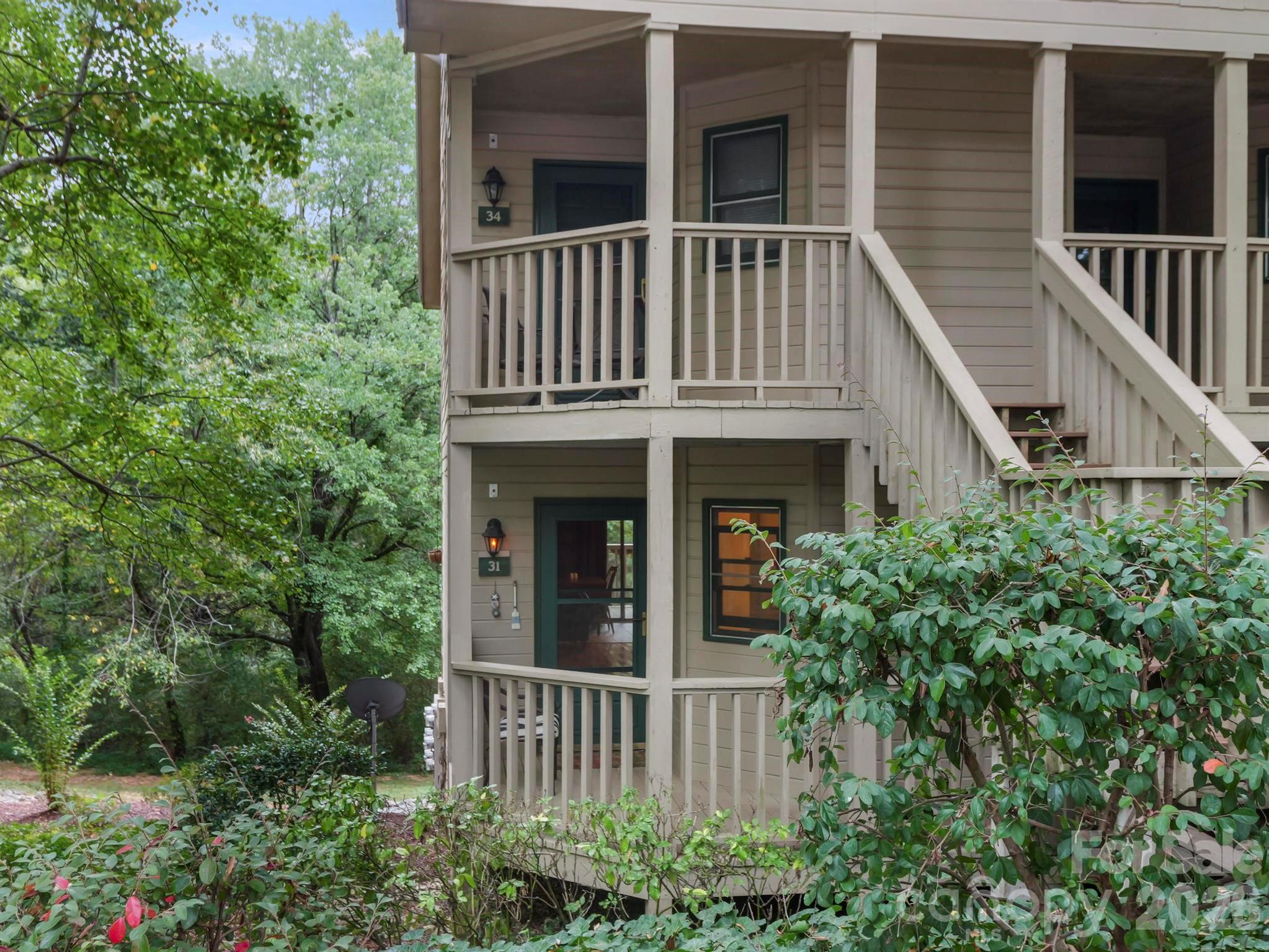 Well appointed 'turn-key' studio condo in Rumbling Bald At Lake Lure.  Desirable end unit facing the woods on lower level. Wood & tile floors thru-out w/attractive yet subtle separation between KIT & open living/sleeping area w/wood ceiling over KIT. Living area has beautiful HWDs leading into BA vanity, w/tile flooring in shower/tub area. Comfy queen bed along w/a unique sleeper sofa that transitions into either 1 single or 2 single beds. Plenty of storage hideaways in furniture plus a fully functional KIT. Full size refrigerator, 4-burner electric stove & oven plus stand alone microwave. Kitchen table has 2 drop leaves to utilize space or extend out for additional seating. Sliding glass door leads to nice size deck overlooking mountains facing south & giving way for evening sunset glows. Outdoor curtains add a nice privacy touch when needed. Easy living/vacationing all while enjoying all that Rumbling Bald has to offer from golfing, water activities, hiking, tennis/pickleball & beach on Lake Lure.