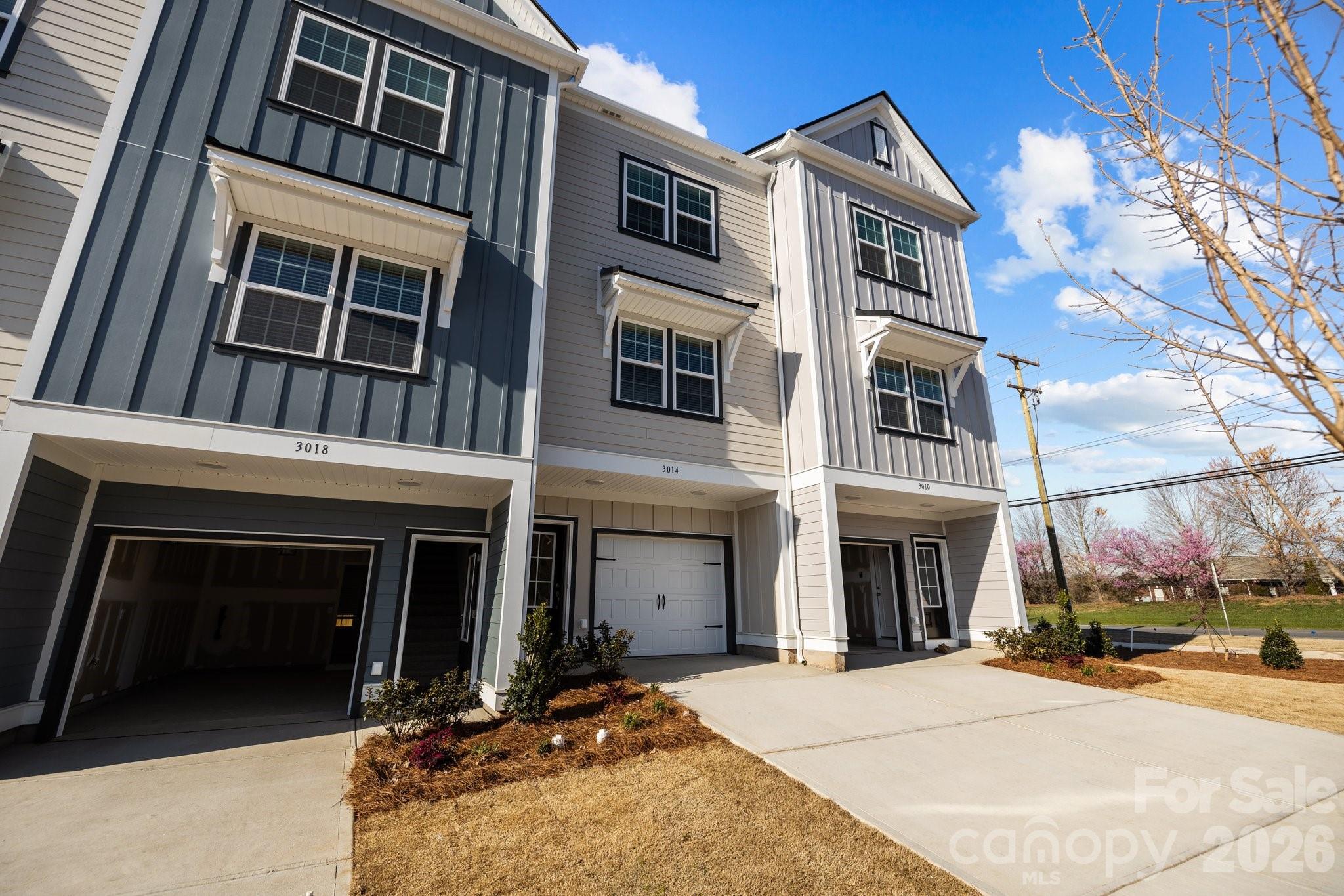 New Adjusted Price and New Construction only 2 miles from historic downtown Matthews! Move in Ready!  Only 62 homes total in this quaint neighborhood. Efficient, well-appointed townhome w single car garage. Designer-inspired 42" soft close kitchen cabinets, granite countertops, stainless steel appliance package, recessed LED lighting, LVP flooring and more. Includes ceiling fans and blinds on all windows. Amenities include walking trails, 2 bark parks, tot lot, green spaces and hammock stations.  This is the only new construction at this price point in this zip code!! All Landscaping, water and sewer included in HOA dues.