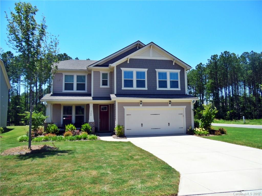 Nearly new and stunning! Walk in to this 4 bedroom, 2.5 bath beauty and immediately fall in love. Inviting floor plan that beckons you to relax by the fireplace in the family room or entertain from the kitchen of your dreams with huge island, gas cooktop and custom cabinetry. Wind down after a long day in the 1st floor private master retreat with gorgeous master bath. Home also features spacious secondary bedrooms, an office, and a beautifully landscaped corner lot. Minutes away from Lake Wylie!