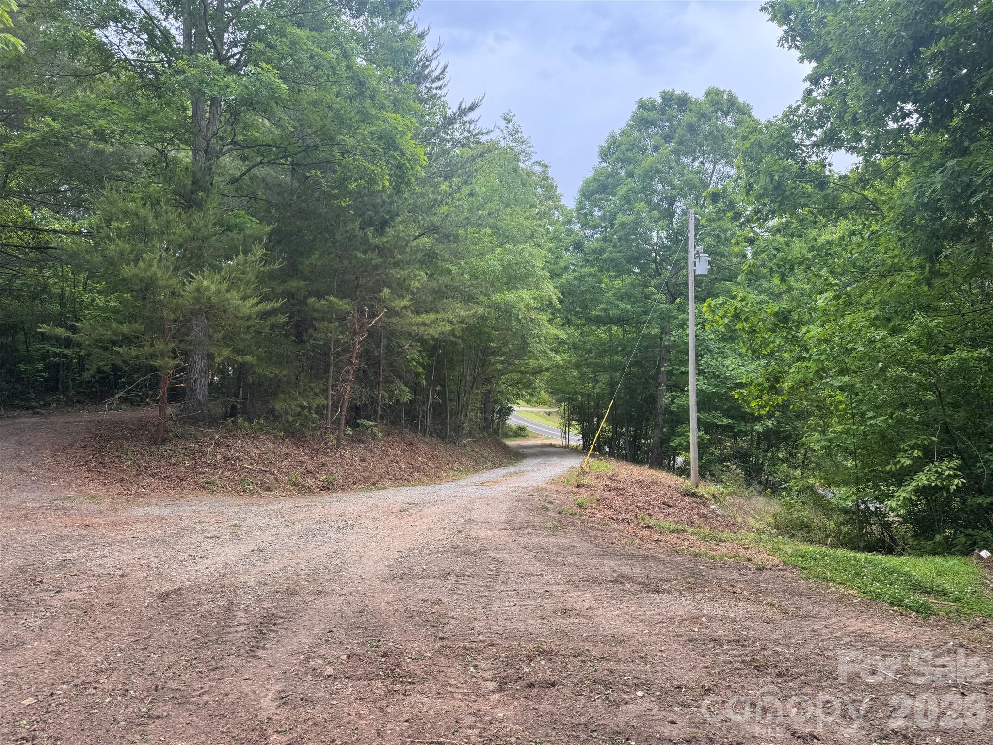 Are you looking to live in a quiet, rural area in upper Cleveland County?  This beautiful 3.8± acre property in Casar, NC offers the perfect blend of privacy and potential. A year-round flowing creek borders one side of the property, adding a unique natural feature and scenic setting. With approximately 900± feet of road frontage, access is easy and provides multiple possibilities for future use.
The property features level topography and a cleared driveway leading directly to a potential homesite, making it ready for your dream home, weekend retreat, or investment opportunity. With many utilities already in place, you will save time and money.  County water is available on Parker Road, electricity runs to a potential homesite, and a 2-bedroom septic system is already on site.
Enjoy the freedom of no HOA and only minimal deed restrictions, giving you flexibility while still protecting the value of the area. Whether you're looking for a quiet place to build or a manageable piece of land with utilities already in place, this property is a rare find in the Casar community.