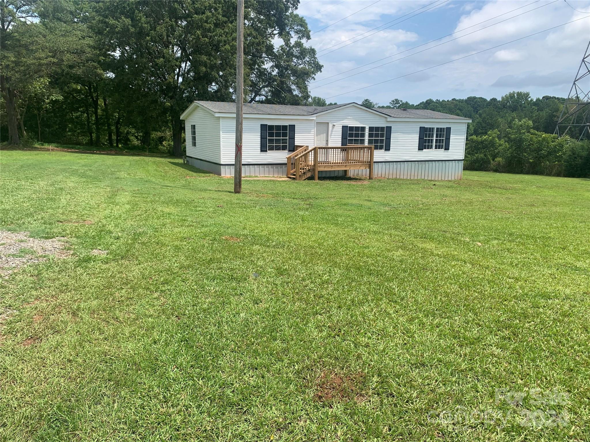 Nice 3 bed  2 bath home just renovated outside of York SC. Home is sitting on 1.5 acres with nice shade trees in the back for relaxing in the summer months. You can just move in because it has new paint, carpet,  new refrigerator and new  oven. The seller built a deck with over size lumber, very sturdy.  The bathroom comes with a new Safe Step Walk In Tub you can use or remove it easily. The property is on Hwy 5 towards Rock Hill SC. It's on a nice level lot.
