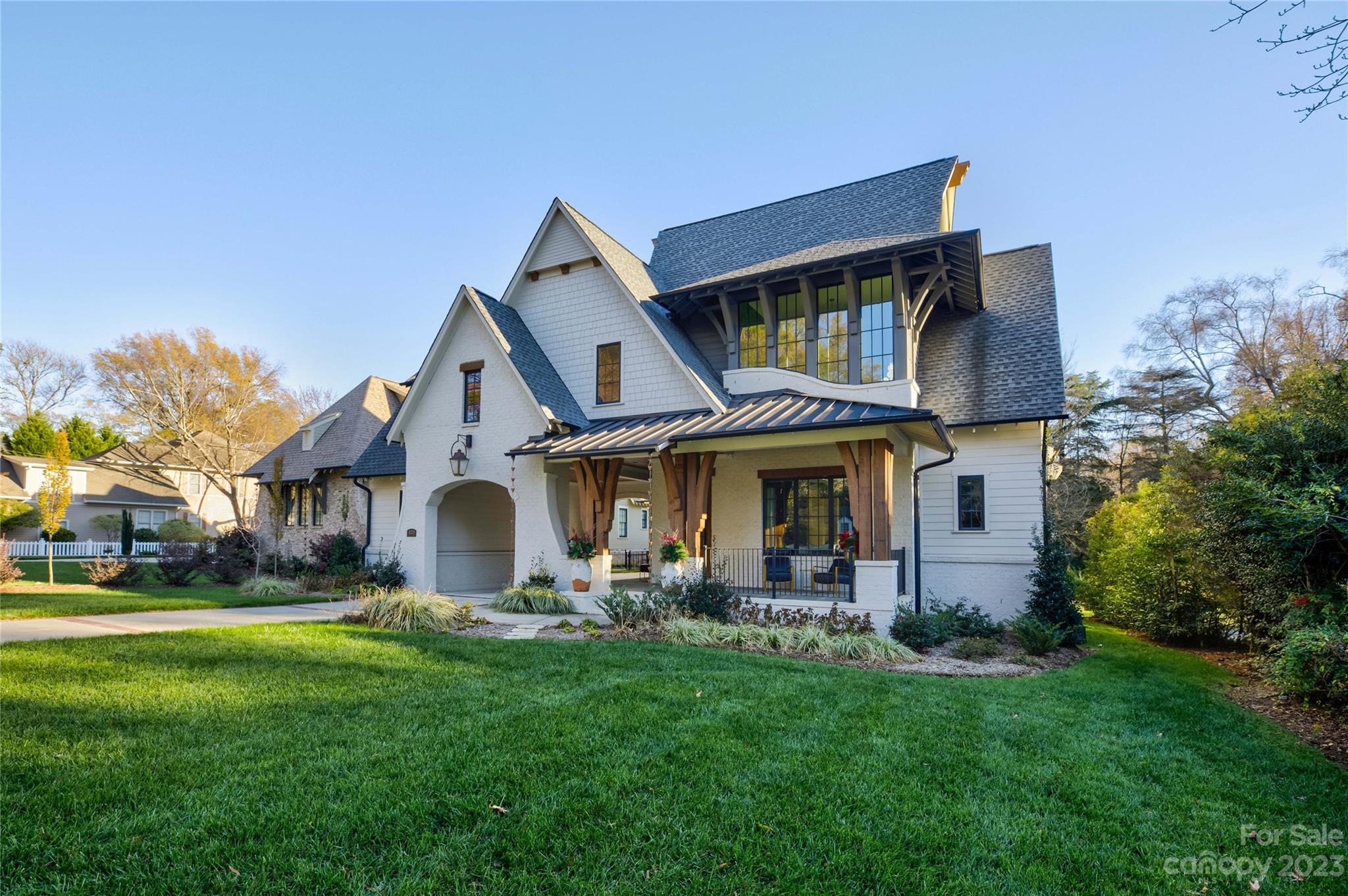 4028 Churchill Road is a true embodiment of modern luxury and sophistication. Boasting remarkable architecture and curb appeal, including a porte-cochere, wrap-around front porch, metal roof accents, and a striking waterfall window, this home is a visual delight. Inside you will discover a smart home where every detail has been meticulously considered. The chef's kitchen is a culinary dream with custom locally crafted cabinetry, a 48" duel fuel range, a walk-in pantry, and a scullery complete with a second dishwasher, wine fridge, and handcrafted wine racks. The living room exudes warmth with a cozy gas fireplace adorned with an Italian tile surround. The primary bedroom graces the main floor offering a private sanctuary. The screened-in porch with a second gas fireplace and mounted Infratech heaters provides a serene retreat overlooking the expansive yard space, perfect for year-round enjoyment. This home redefines luxury living with its chic, modern, and celebratory allure.