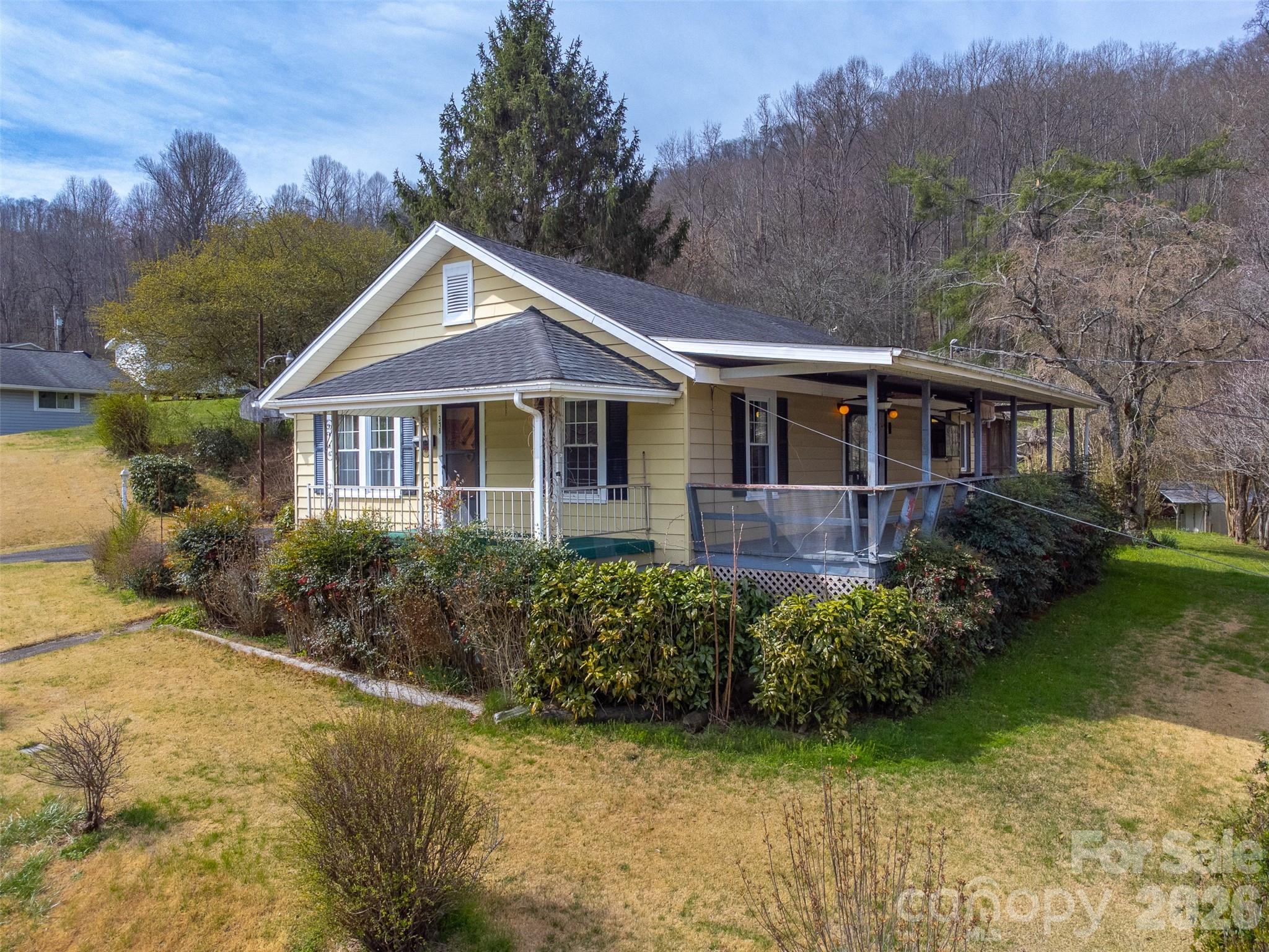 Charming and move-in ready, this 1945 cottage blends classic character with everyday functionality. This home offers 3 bedrooms and 2 full baths, and features original hardwood and parquet flooring, a second living room, and a cozy eat-in kitchen perfect for casual dining. Enjoy outdoor living with both a covered side porch and a screened-in back porch, ideal for relaxing or entertaining. Storage is abundant with a pull-down attic that is fully floored, providing excellent additional space. The property also includes an extra lot behind the home with a roughed-in driveway, offering incredible potential. Zoned High Density Residential, this unique opportunity allows for the possibility of adding another home, duplex, or additional development. A rare find with flexibility, charm, and room to grow!