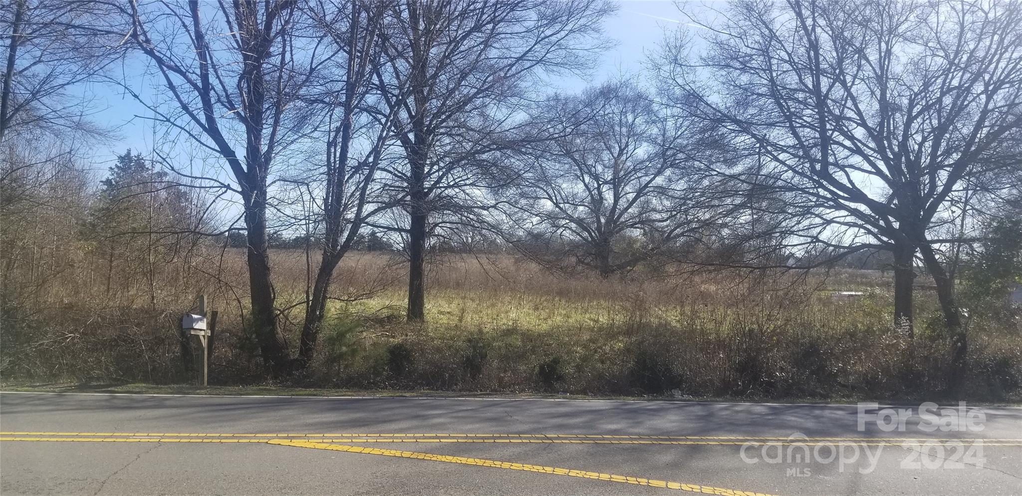 Partially wooded, large tract of land in a highly sought after area of Huntersville, convenient to Lake Norman and I-485. No HOA dues. Property can be divided. Perfect for a ranch site, farm, residential development: single family.  City water/sewer available.  This 44+ acres is 20 minutes to Uptown Charlotte and 25 minutes to Charlotte Douglas International Airport, 5 to 10 minutes to Birkdale shopping and dining.