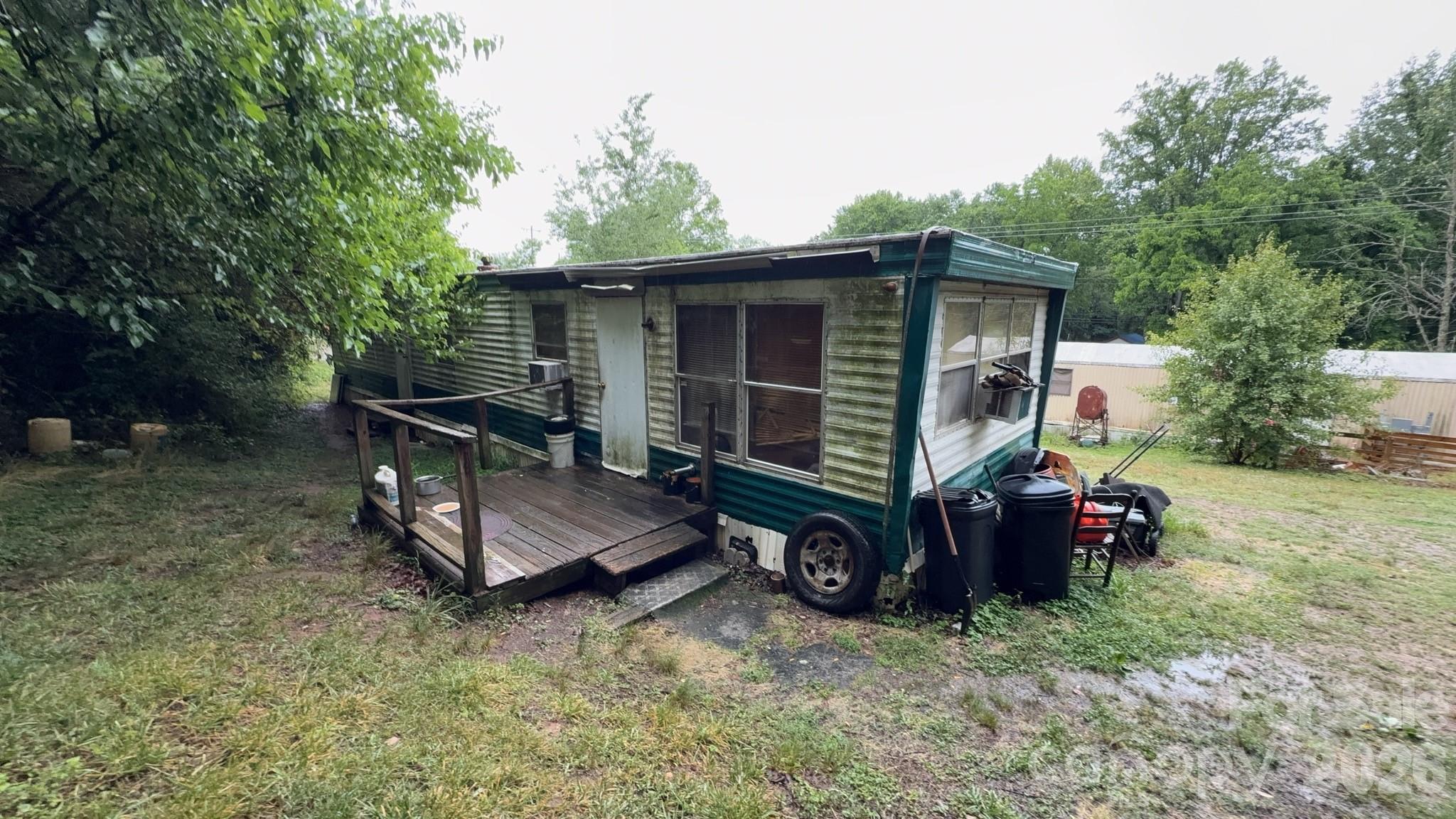 Unlock the potential of this unique investment property featuring three separate structures situated on a 1.07-acre lot. The main home is a 3-bedroom, 1-bath "bare bones" residence offering a blank canvas for renovation, value-add improvements, or redevelopment. In addition to the primary home, the property includes a mobile home and a trailer, both of which are currently rented, providing immediate income potential. Whether you're an investor looking to expand your rental portfolio, a developer seeking land with multiple-use possibilities, or a buyer looking for a property with built-in income streams, this opportunity deserves a closer look. With over an acre of land, there is room to explore future improvements while benefiting from existing rental occupancy. All three structures convey with the sale. Property is being sold as-is. Don't miss this chance to acquire a versatile property with multiple income-producing units and endless possibilities. Schedule your showing today and see the potential for yourself! This is an ENTRY ONLY listing! Listing firm does not hold EMD.