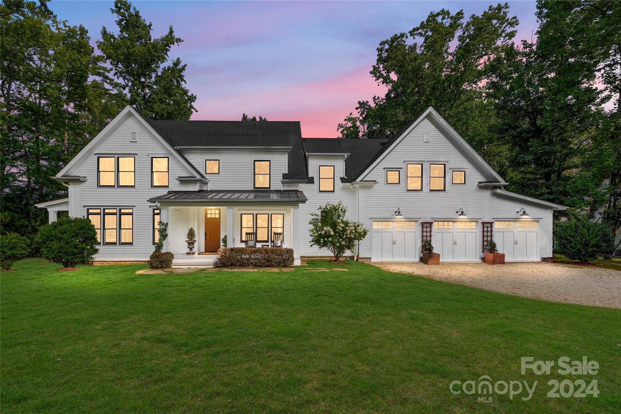 Casually chic contemporary farmhouse-style waterfront home w/picturesque views from nearly every room. Enjoy sunset and sunrise views from the abundance of all the windows throughout the house. This beautiful property is situated on a peninsula at the end of a quiet cul-de-sac street, providing a peaceful retreat from the hustle and bustle of everyday life, and no HOA! The renowned John Marshall Custom Homes built the home and features meticulous attention to detail, including an expansive chef's gourmet kitchen with soapstone countertops, gas cooktops, double ovens, a built-in refrigerator/freezer, and ample cabinetry for storage. The mudroom off the pool and garage has locker-type cabinets for all your water toys, towels, etc. Take a moment to unwind on the side porch w/ the daybed porch swing to enjoy the views of the lake, splash in the pool to cool off, or jump off the dock into 18-20 feet of water at full pond. Your private oasis. Savor the tranquility of luxury lakeside living!!
