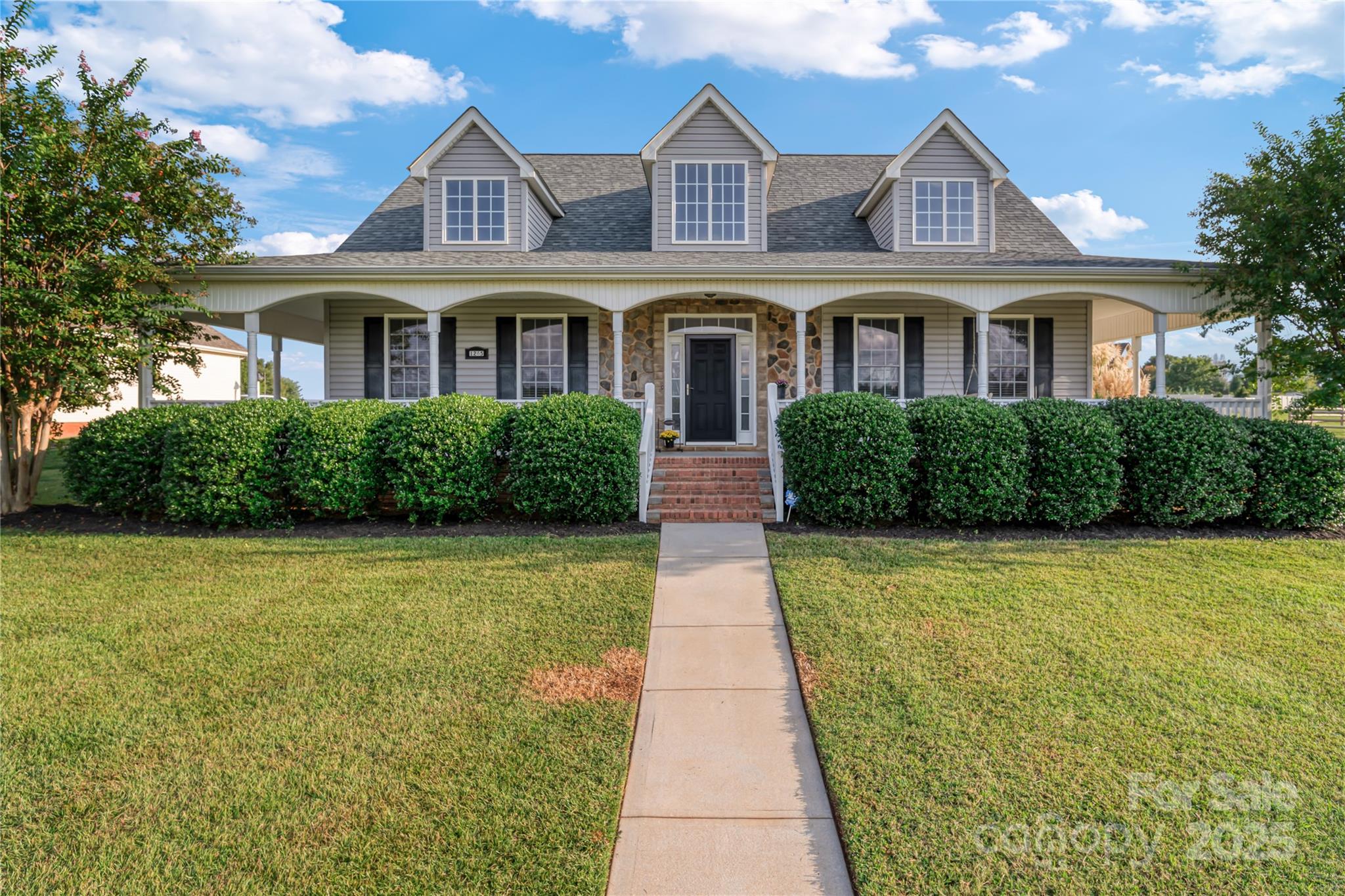 Welcome to this charming home on nearly 1/2 acre, located in the highly sought-after Stoneridge Lakes community! This meticulously maintained 4-bedroom, 3-bath home has a beautifully manicured lawn and an oversized front wrap-around porch complete with a southern-style rocking chair swing! Inside, you’ll be greeted by gleaming hardwood floors throughout the main living area and an abundance of natural light. The family room features vaulted ceilings, custom built-ins, and a cozy wood-burning fireplace. The formal dining room leads into the chef’s kitchen, where you'll find SS appliances,granite counters,white subway tile backsplash, & ample cabinetry and counter space. Step outside to the private screened-in porch. The large primary suite offers vaulted ceilings, dual quartz countertops, a walk in shower, and a separate tub. 3 additional well-sized bedrooms and a spacious bonus room complete this home. Conveniently located- near York Prep& Northwestern HS and minutes from Heckle Blvd.