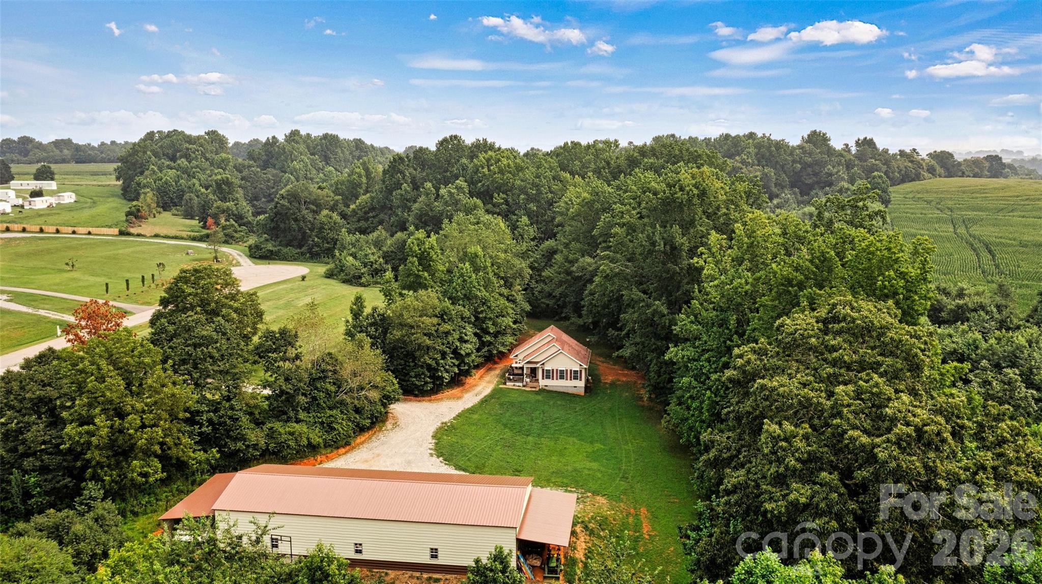 Motivated Seller! Bring your offers!! Charming versatile homesite, in the country, on over 4 acres with a 5 bay metal garage - just upgraded to 3 bedrooms!!! You must visit this property to truly appreciate all it has to offer. Situated on a very private lot at the end of a quiet road, you are sure to enjoy peaceful mornings on the back deck watching the animals that come to visit. This house has been upgraded and now is outfitted with a 3rd bedroom (see new septic permit in the MLS) The floorplan layout presents private quarters for those living here; however, you can come together in the large open living room to enjoy game time or movie night. The soaring ceiling in the living room and 2nd bedroom gives off mountain cabin vibes. Within the unique layout of this cozy home, is the opportunity to live comfortably and together, but also retreat to your own private sanctuary for rest and relaxation. Outdoors on the 4+ acres there is room to expand the compound, or park large vehicles like RV's, campers, 4 wheelers and boats. The fantastic 5 bay garage is sure to be a hit for those with multiple vehicles or who are looking for a workshop. It is already complete with an office room set up inside for those who work from home. This property is so flexible it can be just about you can dream up.  All of this with still having conveniences to town within a 15/20 min drive. All appliances will remain. Book your tour today and see what your new chapter could look like tomorrow.
