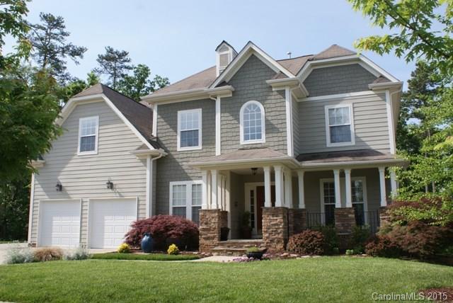 Spectacular home in desirable Chestnut Hill/Lake Shore in Tega Cay. Two-story great rm w/gas fp. Gourmet eat-in kitchen w/granite counters, custom cherry cabinets, gas cooktop and dbl ovens. Master suite on main, huge bath, his and her custom walk-in closets. Formal dining rm w/tray ceiling, library/ofc w/French doors & laundry/mud rm. Second level features 3 generous bdrms, one w/private access to deck. Huge rec rm. Incredible wooded lot, fenced backyard. Don't miss workshop & add'l storage.