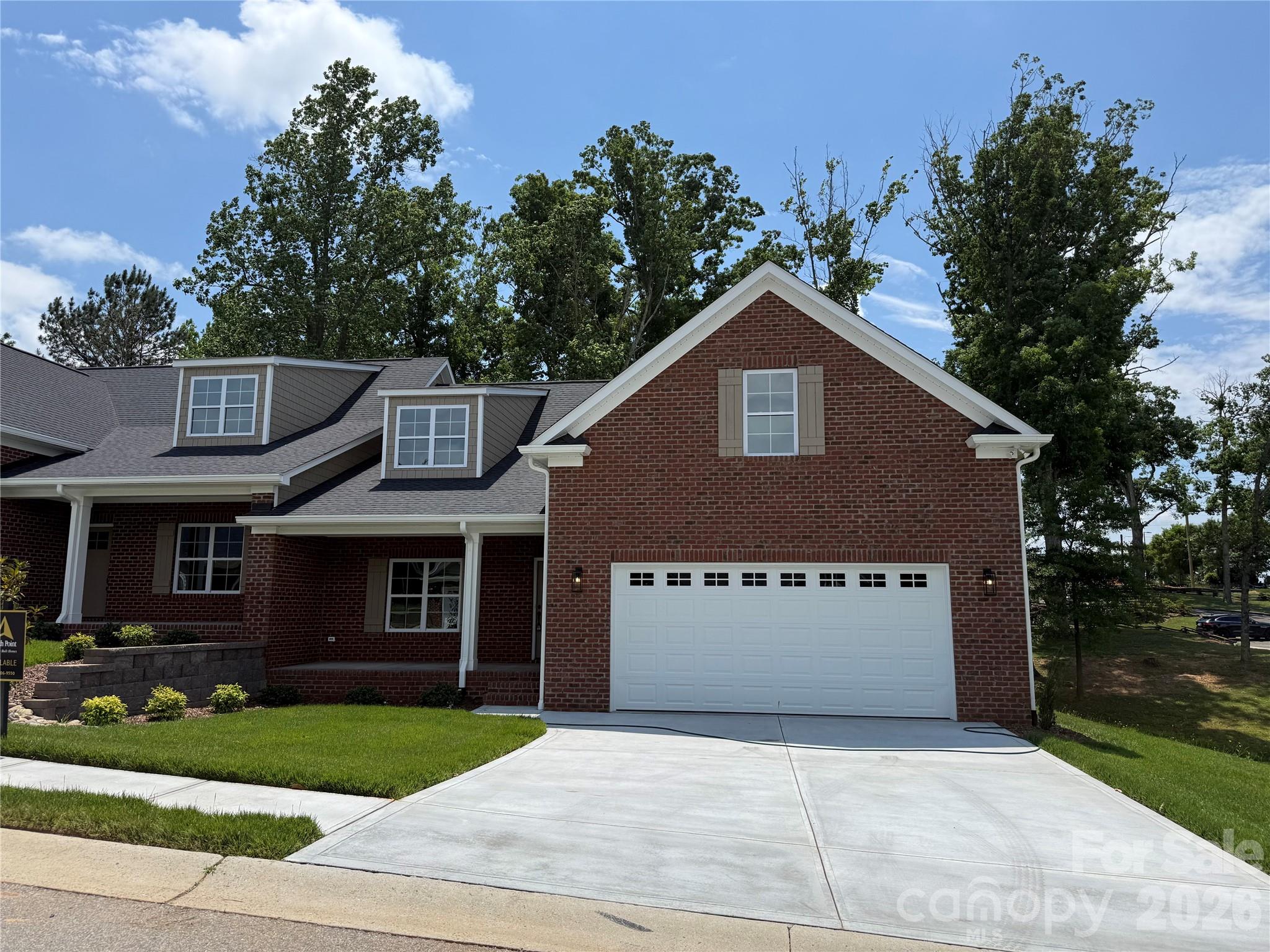 Don't miss one of the last two NEW CONSTRUCTION brick townhomes in the beautiful Magnolia Plantation! With 3 bedrooms, 2 baths, and an open floor plan, this home checks all of the boxes. A covered rocking chair front porch welcomes you into the large vaulted ceiling family room, dining area, and kitchen with breakfast bar. Beautiful finishes including quartz countertops, custom backsplash, stainless steel appliances, and high end cabinetry. Primary bedroom has tray ceiling and en-suite bathroom with dual vanities, spacious tile shower, and large walk-in closet. Second bedroom with a view of a small pond and additional hall bathroom on main level. Upstairs is a 3rd bedroom to be used as you wish! Large, partially covered Trex deck off the kitchen for great outdoor living. Also, there is a Rinnai tankless water heater for on demand hot water. Check out the completely finished garage - North Point Custom Builders overlooks no detail! Great location close to Hwy 74 and Uptown Shelby!