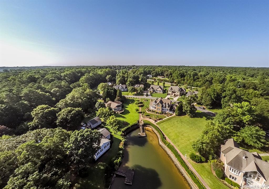 Beautiful Lake Wylie view home located in amenity filled Lake Club community across from one of several shared day docks.  Features Incl: Main level Master w/remodeled master bath (quartz counters, tile floor, & marble tile surrounding bath & shower), a Guest or In-law wing (split BR plan), newly remodeled Gourmet Kitchen w/top of the line stainless appliances, huge island w/granite, tile floors and so much more.  Upstairs boasts 2 BR’s plus bonus & office.  See photos & video for more features.