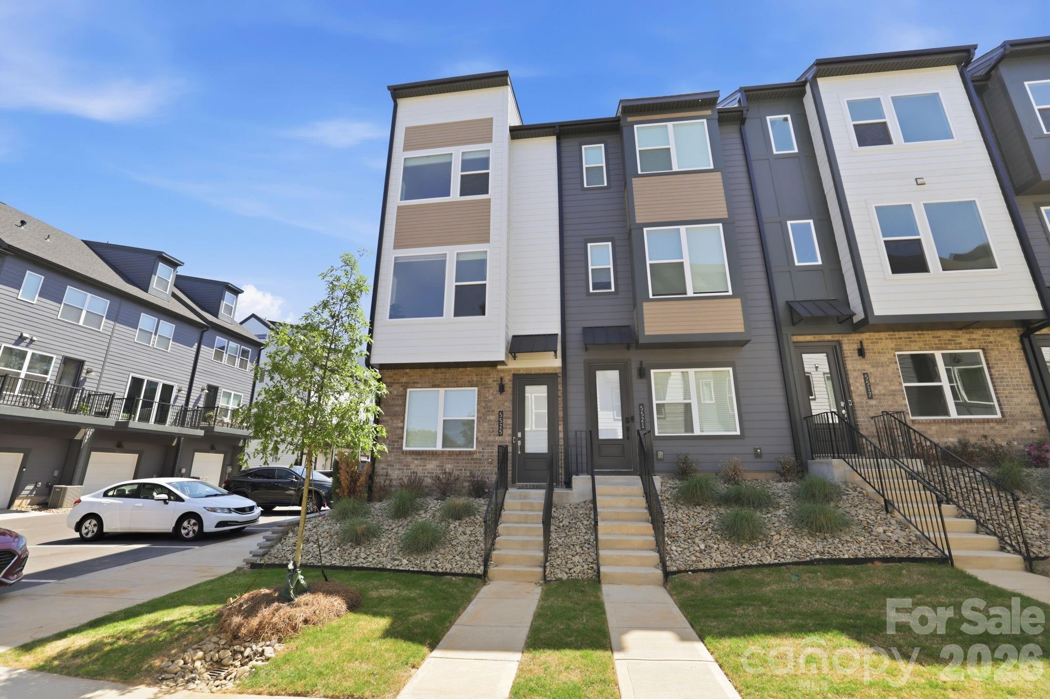 Attractive New Pricing On This Already Beautiful Home!! Welcome to the NEWLY gated townhome community of Southmont. This stunningly appointed home exudes effortless sophistication, designer quality living with todays high tech conveniences. Interior End-Unit with tandem 2-Car garage and third open driveway space,  extra storage and electric vehicle plug-in. Beautiful oak wood stairs and railings throughout welcome you in. Enjoy an Incredible light filled living space with Seamless flow throughout the main living area all enhanced with LVP flooring. Dreamy kitchen offers quartz countertops, subway backsplash, island w/seating, touchless faucet, premium Cafe SS appliance package, Samsung French door refrigerator with beverage center, and spacious pantry. Adjacent balcony offering the perfect place to unwind or start your day. Owners suite features dual sinks, quartz countertops, tile flooring, and spa style shower tile/flooring, and dual closets. Additional secondary bedroom with own en-suite bath and hall laundry room rounds off the upper level. Third floor offers endless possibilities for flex space, private office retreat, play area, or additional bedroom with private bath. Southmont offers a fully gated community with gate cameras, customized guest passes, a Pickleball Court, & walking distance to the Archdale Light Rail Station. Short drive to everything Charlotte: 15 minutes to SouthEnd, 10 mins to Uptown City Center, 10 mins to SoutPark & 20 mins to CLT Airport. All appliances included, better than NEW. Call today for your personalized tour.