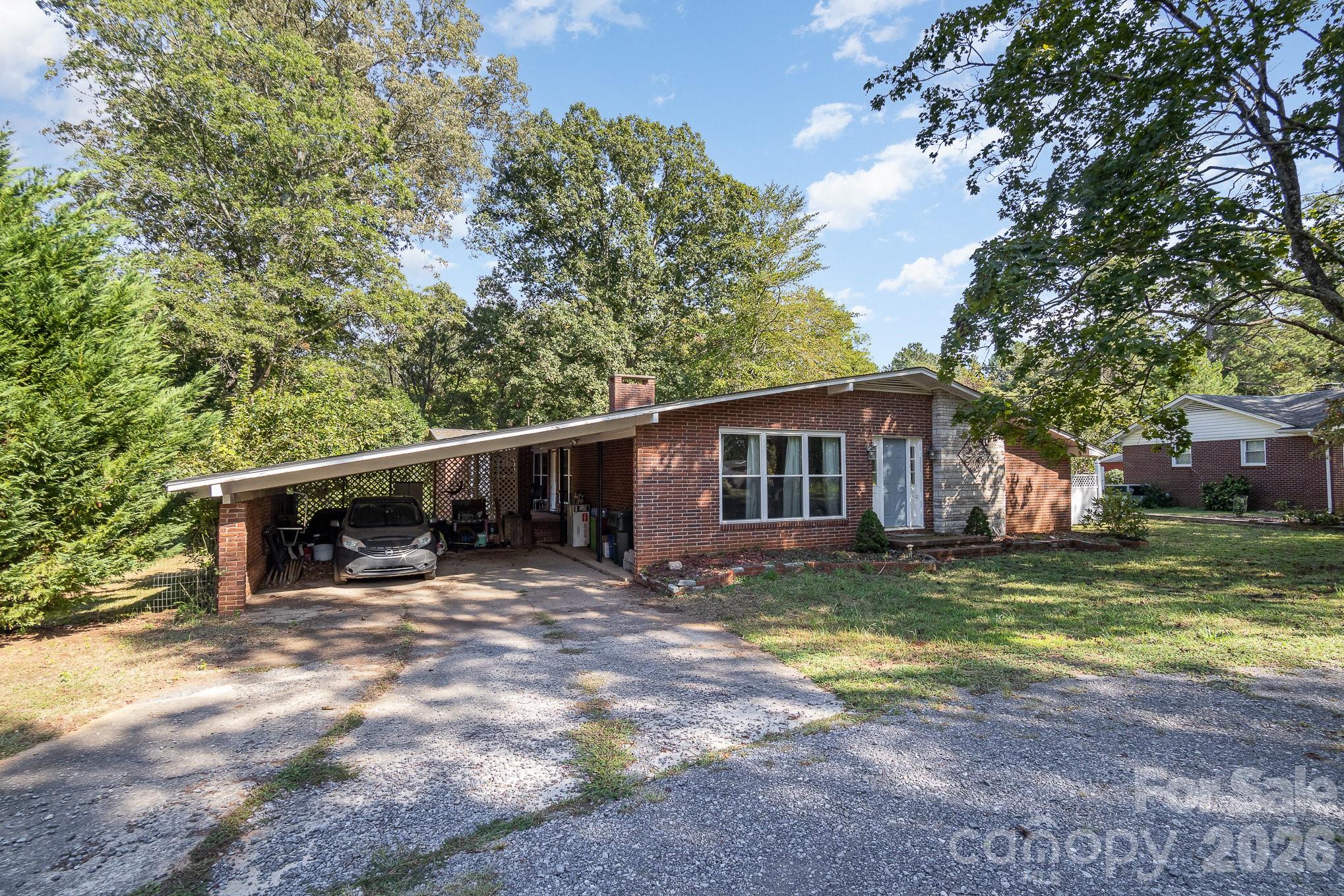 Priced to Sell FAST – Incredible Value & Investment Opportunity!

Welcome to this beautiful mid-century ranch in the heart of Rock Hill, SC—where timeless character meets modern upgrades and unbeatable potential. This 3-bedroom, 2-bath home offers a rare opportunity to own a property with good equity potential.

Step inside to an open, light-filled layout perfect for today’s lifestyle. The kitchen features granite countertops, ample prep space, and flows seamlessly into the main living areas—ideal for entertaining or everyday comfort. The spacious primary suite includes a unique laundry chute, adding both charm and convenience.

Outside, enjoy a large covered veranda—perfect for relaxing or hosting guests. The circular driveway and 2-car carport provide easy access and plenty of parking. Need more space? The basement with exterior entry offers endless possibilities—create a workshop, home gym, studio, or expand your living space.

Located in a desirable Rock Hill neighborhood, just minutes from shopping, dining, and easy access to Charlotte, NC, this home is perfect for homeowners, investors, or anyone looking to build instant equity.

Opportunities like this don’t last—schedule your showing today and secure this deal before it’s gone!