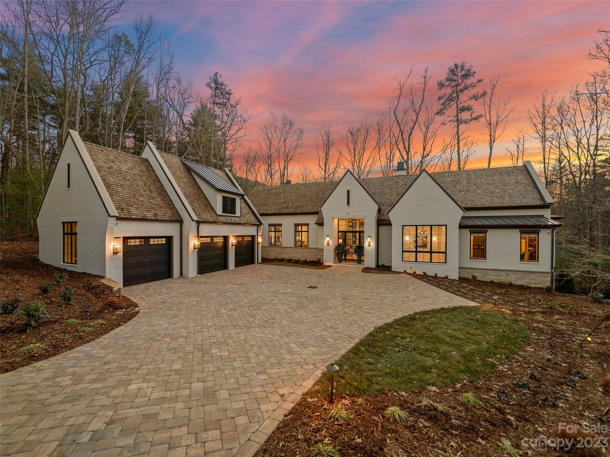 Nestled in The Ramble, one of Asheville’s premier luxury communities, this contemporary new construction home is as stunning as it is special. As you place your hand on the grand, oversized pivot-hinged door, you immediately feel the quality that is synonymous with a Dillard Jones built home. Stepping inside, your eyes are drawn to the expanse and beauty of this open concept floor plan with main level living. Abundant light fills the two-story great room through the large windows and sliding doors that open onto your beautiful and private covered porch that practically doubles your entertainment space. From the fantastic chef’s kitchen to the exceptionally well-appointed primary bedroom en suite, you are enveloped by high-end finishes and the latest in smart technology. The lower level boasts three additional en suites, family room and gym. Near walking trails and the Living Well Center you are close to everything, yet you feel like you are tucked far away in your own secluded oasis!