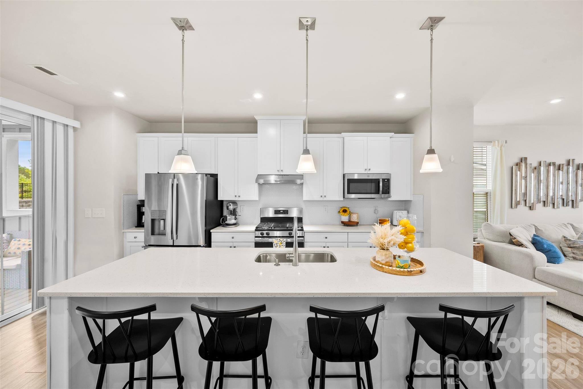 Welcome to Trinity Townes — Where Low-Maintenance Living Meets an Unbeatable Location!
This stunning 4-bedroom, 3.5-bath END UNIT townhome offers the space, style, and lifestyle you've been searching for. As an end unit, enjoy added privacy and extra natural light throughout.
Step inside and be impressed by the thoughtfully designed open floor plan on the second level. The gorgeous kitchen features a large island perfect for gathering, crisp white cabinetry, stainless steel appliances, and granite countertops — all flowing seamlessly into the dining area and inviting living room. LVP flooring runs throughout the main level, adding both beauty and durability. A convenient half bath completes this level. Just off the kitchen, step out onto your spacious covered porch — the perfect spot for morning coffee, evening relaxation, or entertaining year-round.
Head upstairs to find three comfortable bedrooms, two full baths, and a conveniently located laundry area — no hauling clothes up and down stairs!
The lower level is where functionality shines. A private fourth bedroom with a full bath makes an ideal guest suite, home office, or flex space. You'll also find a drop zone to keep life organized, a storage closet, and direct access to the 2-car garage. Step outside to your private patio and enjoy your own slice of backyard space.
Living in Tega Cay means access to an incredible array of amenities — scenic walking trails, beaches, a boat ramp, tennis and pickleball courts, and multiple sport courts. The Tega Cay Golf Club and Tega Cay Beach & Swim Club (membership fee applies) are just moments away, and with Lake Wylie nearby, the lake life is truly at your fingertips.
Commuters and shoppers will love the prime location — just minutes from the vibrant Kingsley and Baxter Village areas, with plenty of dining, retail, and entertainment options close by. Quick access to I-77 makes getting anywhere a breeze.
Zoned for the highly sought-after Fort Mill Schools — one of the top school districts in South Carolina.
Don't miss your chance to own this move-in ready gem in one of the area's most desirable communities!
