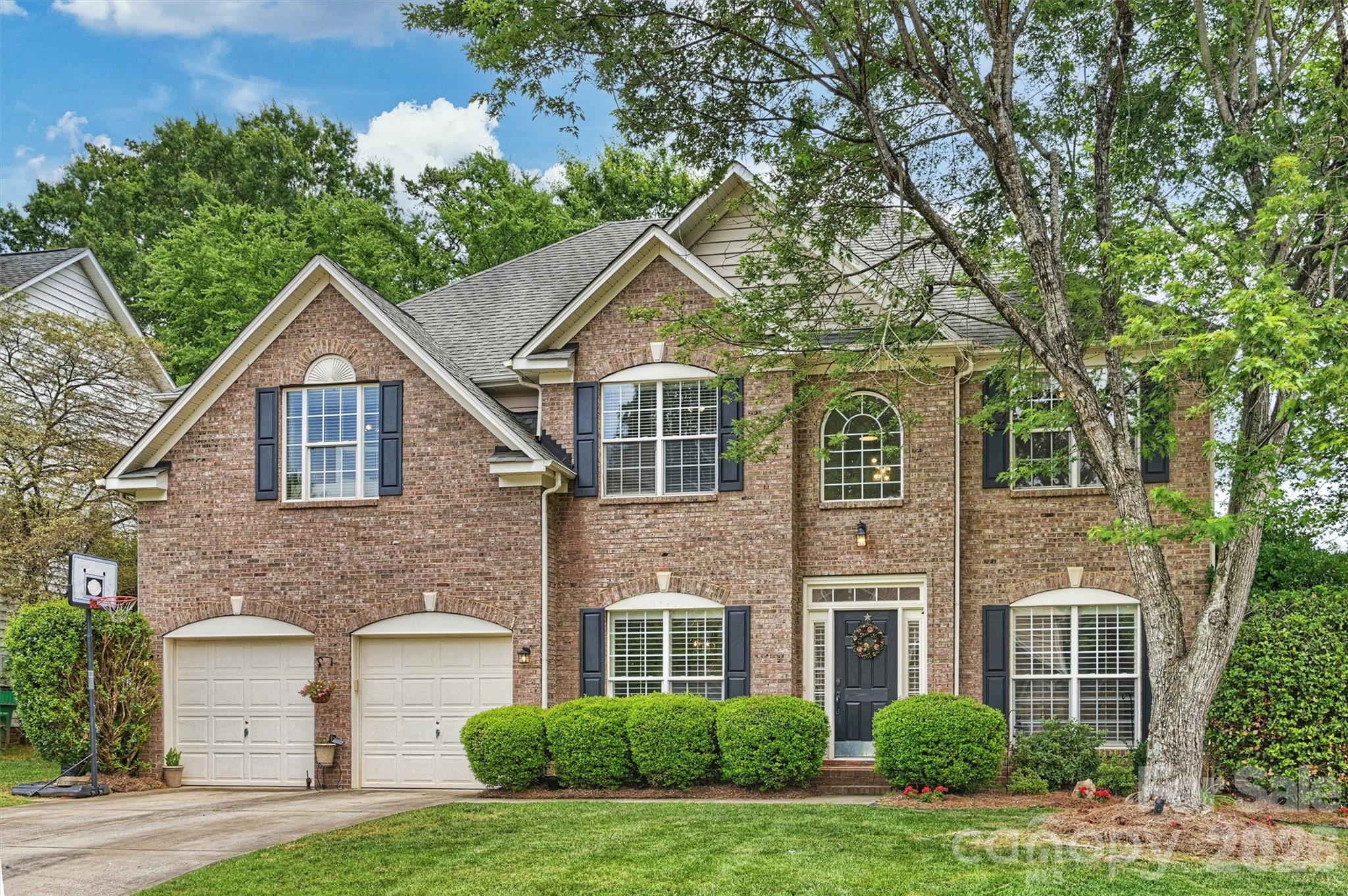 Stately brick-front home in the heart of Ballantyne featuring luxury vinyl plank flooring throughout the main level and fresh interior paint in today's neutral tones. The open floor plan welcomes you with a dramatic two-story foyer that flows into the spacious two-story great room, complete with a gas fireplace and floor-to-ceiling windows overlooking the private backyard.

The kitchen is designed for both everyday living and entertaining, offering stainless steel appliances, a center island, sunny breakfast area, and direct access to the screened porch. A butler's pantry adds both storage and functionality, while the formal dining room and separate living room or office provide flexible spaces to fit your lifestyle.

Upstairs, a newly painted staircase and catwalk overlook the great room below and connect the secondary bedrooms. The spacious primary suite features a vaulted ceiling, separate sitting area, and plenty of room to relax and unwind.

Enjoy outdoor living in the level backyard, perfect for recreation, gardening, or gatherings with family and friends. Community amenities include a recreation area and playground. Conveniently located just minutes from Blakeney Shopping Center, dining, entertainment, and everyday conveniences. Zoned for highly rated schools and situated in one of Charlotte's most sought-after neighborhoods. A wonderful opportunity to enjoy Ballantyne living at its best!