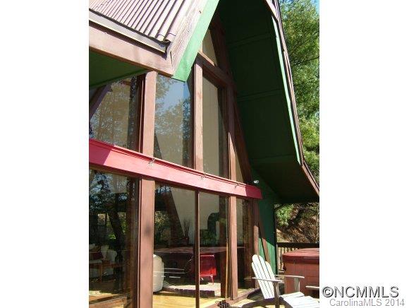 The best of both worlds! Charming chalet with privacy and year round views  but only minutes to downtown on Town Mountain Road. Great as primary residence, long term rental or vacation rental. Updated kitchen, and reconditioned flooring. Contact Broker/Owner Chris Flanders directly for showings. Access via lockbox code 5665