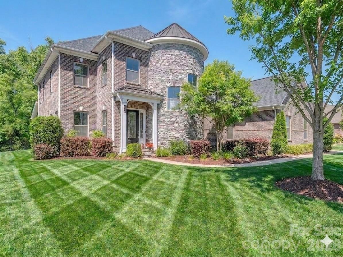 Amazing value on this luxury home in the heart of Weddington! This gorgeous home is priced under market and ideally positioned for its new owners. Welcome to the luxury community of The Falls at Weddington.  Ideally located just minutes from Waverly’s premier shopping, dining, entertainment and all your everyday needs.  Large community offers social events, neighborhood get-togethers and tons of activities designed to meet your neighbors. Conveniently located in the heart of Weddington just minutes from some of the state’s highest ranked schools.  This meticulously maintained home offers everything you are looking for with today’s modern comforts. Home achieves high energy efficiency with money savings for you using UV blocking windows, spray foam insulation and multi speed HVAC controls.  This well thought out floorplan with 10-foot ceilings and extensive wood flooring is perfectly suited for multi-generational living with room for everyone.  The main level features an upgraded primary suite with dual walk-in closets, and a spa inspired bath with raised height his and her vanities and an expansive walk-in shower.  The main floor flex room provides an ideal office or craft space, while the designer chef’s kitchen impresses with its massive center island, bar seating, and generous 14' x 4' walk in pantry.  Living room showcases a gas fireplace framed by custom built ins and flows seamlessly into the dining area, creating an inviting environment for everyday living and entertaining.  A well-appointed laundry room with storage and utility sink adds added convenience.  The large, screened porch overlooks your private, fenced yard and patio, offering a serene outdoor retreat to enjoy the outside year-round. In ground irrigation keeps the yard looking beautiful year-round. If you have been thinking about a pool the lot is perfectly situated to add one. Upstairs, an oversized bonus room with a walk-in closet anchors the second floor, surrounded by thoughtfully designed bedrooms. Bedrooms two and three share a true Jack and Jill bath, each with its own walk-in closet, while bedrooms four and five each feature private en suites with walk in closets. All upstairs bathrooms are fully tiled. A secondary laundry room enhances the home’s efficient livability. Throughout the home, multiple tray ceilings and an extensive trim and molding package elevate the overall luxury aesthetic. The home also boasts an impressive 1,000+ sq ft three bay garages with an additional tandem bay for a functioning 4 car garage space.  Custom drop zone and large entry closet greet you as you enter the home. Beautiful landscaping with irrigation surrounds the exterior of your home, which backs to community space—offering one of the most desirable and private lots in the neighborhood. Residents enjoy resort style amenities including a pool, fitness center, playground and trails that you can get to from the end of the street without leaving the neighborhood.    This home has been lovingly maintained and is truly move in ready, offering luxury, comfort, and exceptional craftsmanship at every turn.  Call anytime for questions or your private tour!