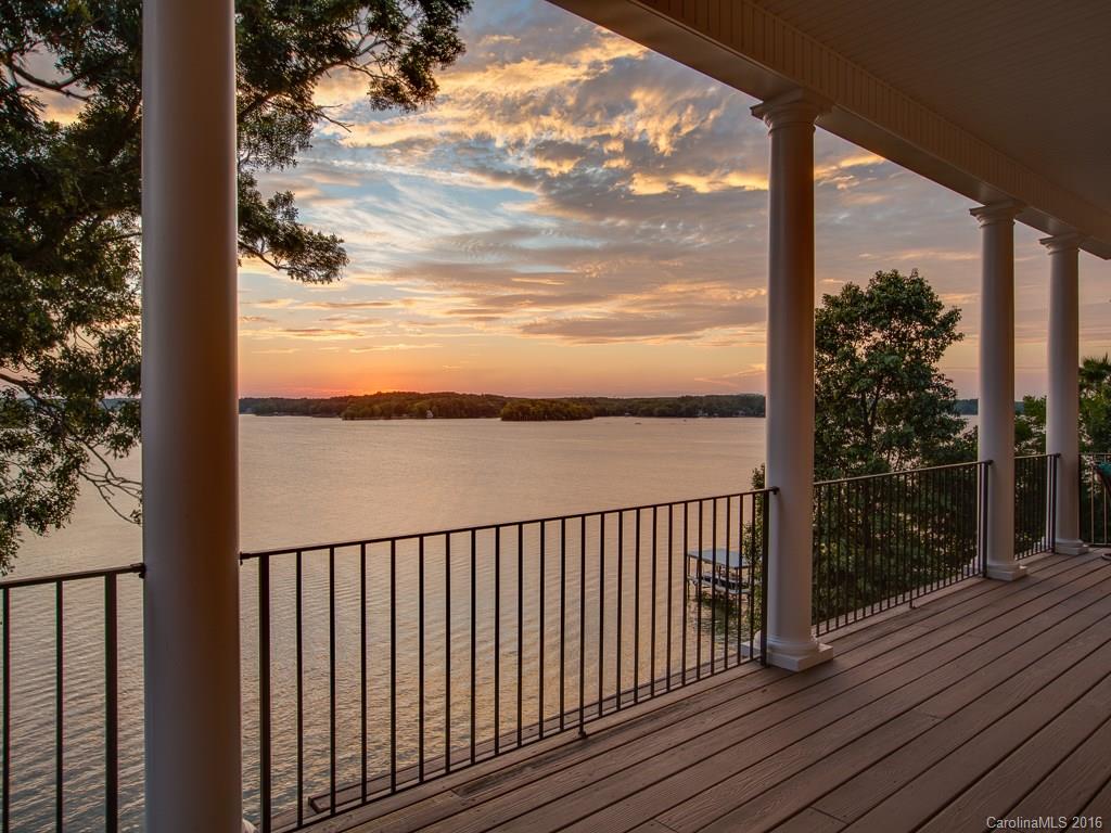 This Tega Cay waterfront home will "WOW" you with its long-range panoramic sunset views of the main channel. Relax in the lakeside saltwater pool and spa, hone your skills on the putting green, and lounge on the huge covered porches overlooking the lake. Gorgeous architectural details throughout, with stone fireplaces in the great room & master. Main level master w/ luxury bath, dream walk-in closet/dressing room. Rec room w/ kitchenette, bar trimmed in gorgeous stone. Covered dock and lift.