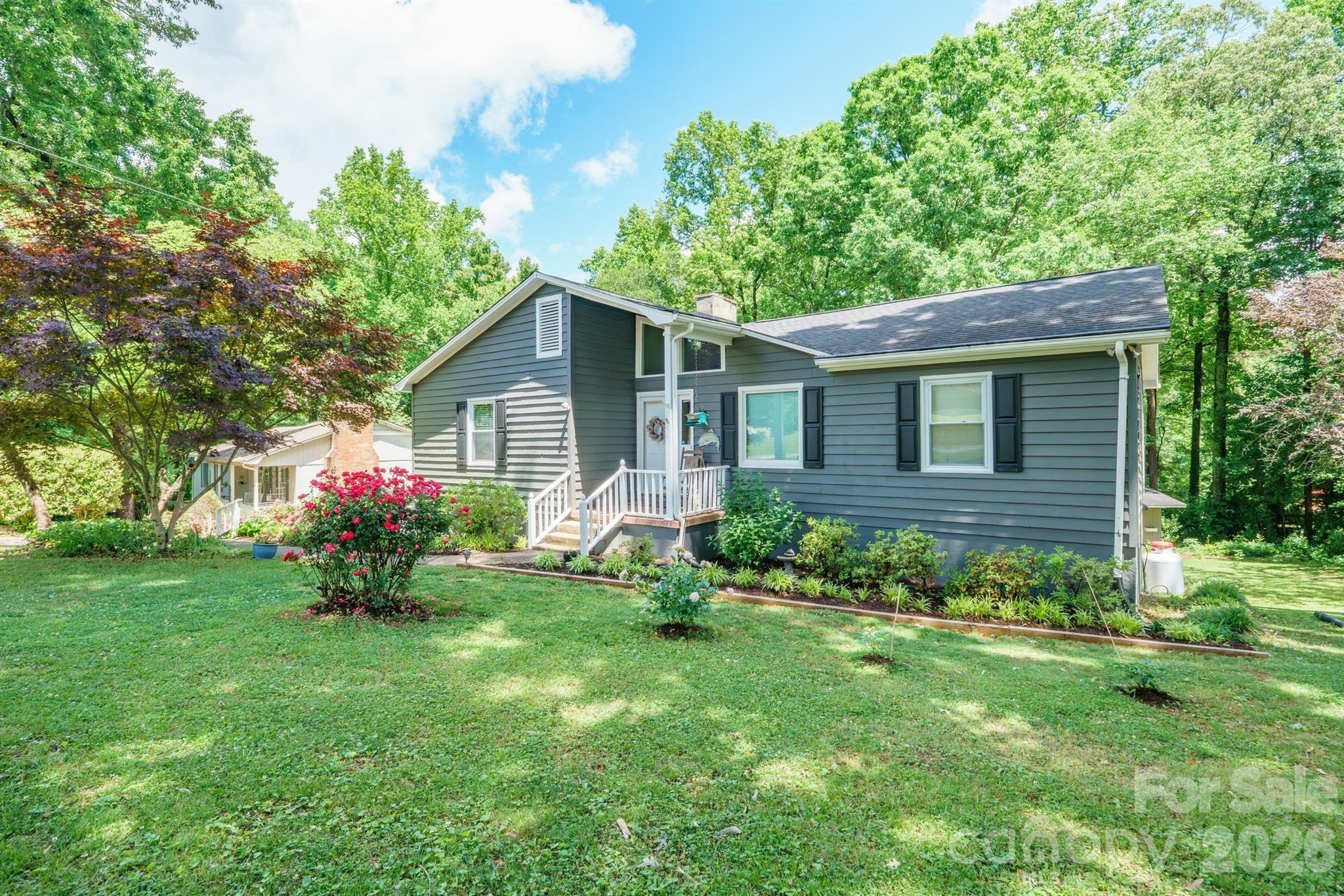 Nestled in a quiet, established neighborhood near Lake Norman, this charming ranch style home offers a blend of peaceful living and functional space-perfectly suited for lake lovers.
The main level presents a warm welcoming living & dining room area with gas fireplace, generous kitchen featuring ample pantry, quartz countertops and a designated laundry area. A kitchen window over the sink is a great space for growing culinary herbs.
The primary bedroom with en-suite has walk-in closet. In addition to the second bedroom and full bath, a sun room opens to the deck adding to the main level living space.
A partially finished basement, with it's own entrance to the outside, features a comfortable retreat with sitting room, an additional bedroom & full bath, as well as a great functional office and additional useful storage space. 
The single car basement garage boasts an expansive workshop area for hobbies, storage or projects.
From the main floor step outside onto a tiered deck overlooking a lush, private backyard framed by a serene wooded area. Mature fig, blueberry, strawberry, & raspberry plantings, as well as pomegranates, peaches and grapes, give way to a seasonal harvest.
An inviting fire pit sets the stage for cozy evenings. A storage shed offers added convenience for tools or additional creative space.
The lavish foliage is a beautiful backdrop to this freshly painted house (2026). Positioned on a tranquil cul-de-sac street makes this property a place to call HOME.