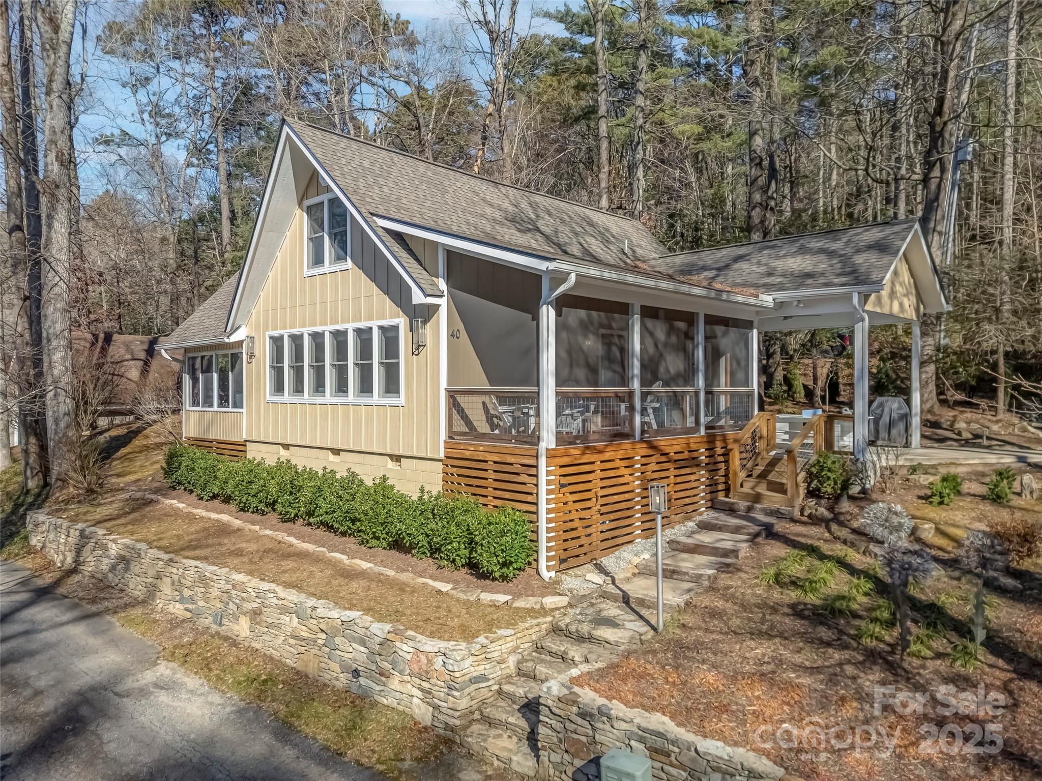 Modern Mountain Charm in Lake Toxaway Estates Experience effortless lake-living in this beautifully renovated mountain retreat, complete with a deeded boat dock on North Carolina’s largest private recreational lake. Blending modern design with warm rustic touches, this home is perfectly suited for relaxing getaways and family gatherings. Step inside to an inviting open great room, anchored by a handsome stone fireplace and filled with natural light. The bright, airy kitchen features custom built-ins, a spacious granite dining counter, and premium Fisher & Paykel appliances, creating an ideal space for cooking and entertaining. The main level offers both a primary and guest room, while the family-friendly sleeping loft includes its own large bath with a walk-in shower—perfect for kids or additional visitors. Easy-care wood floors run throughout the home, complementing the fresh and modern aesthetic. Outdoor living is equally impressive with a cheerful sunroom, a large screened porch, and a covered patio that flows easily into the wooded landscape. Spend evenings around the fire pit, or stroll down to your private dock for a day on the water. Located just minutes from US-64, Lake Toxaway Country Club, and the historic Greystone Inn, this charming home offers the perfect combination of convenience, comfort, and true mountain-lake lifestyle.