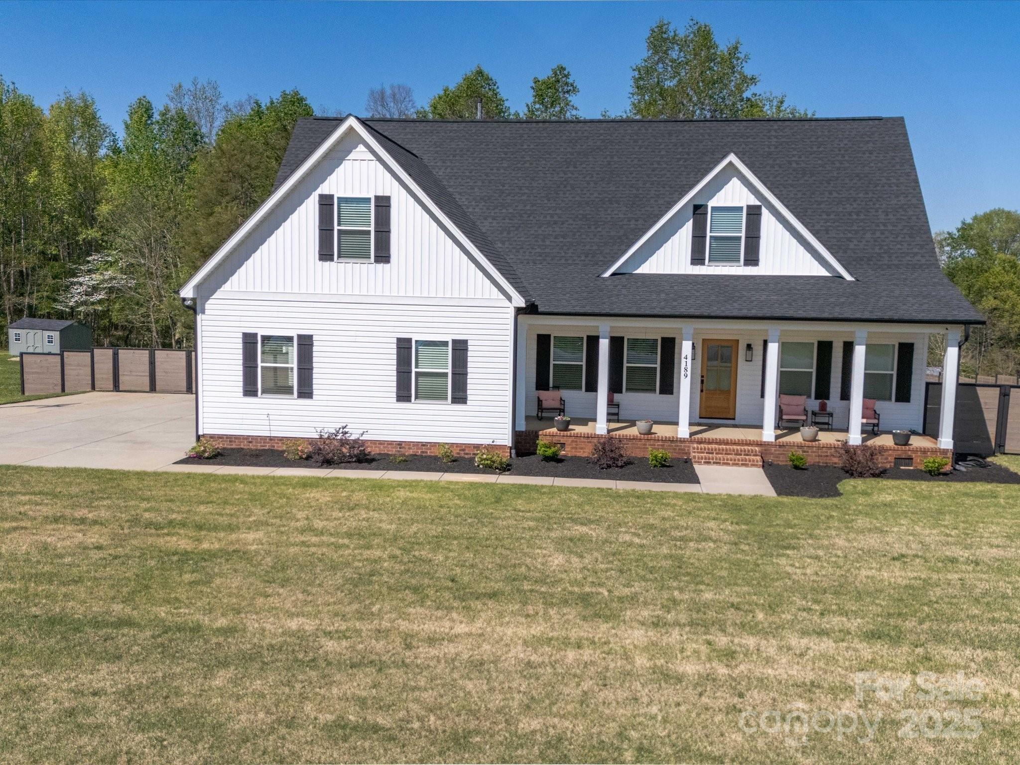 If you are looking for that almost new 1.5 Story, vinyl-sided home with 4 Bedrooms, 3.5 Bathrooms, 2 car attached garage and 2 car detached garage on 1+ acres then this may be the property for you. Approximately 2640 heated square feet. Wonderful, Open kitchen features stainless steel appliances, Gas cook top, Granite countertops, Brick back splash and large Breakfast Bar/Kitchen Island. Vaulted ceilings in the Great Room. Tray ceiling in the Primary Bedroom. 3/4 inch oak flooring in the Foyer, Dining Room, Kitchen, Pantry, Great Room, Hallway, Primary Bedroom and Primary closet. The Primary Closet has a built-in organizer shelving. Tile Flooring in all Full Bathrooms and Laundry Room. Ceiling fans in all Bedrooms and Great Room. 9 ft ceilings on both floors. Large Primary Bathroom with double sinks, garden tub and separate shower. Covered front porch and large rear deck. Fenced Rear Yard. Schedule your appointment to view this wonderful home today!