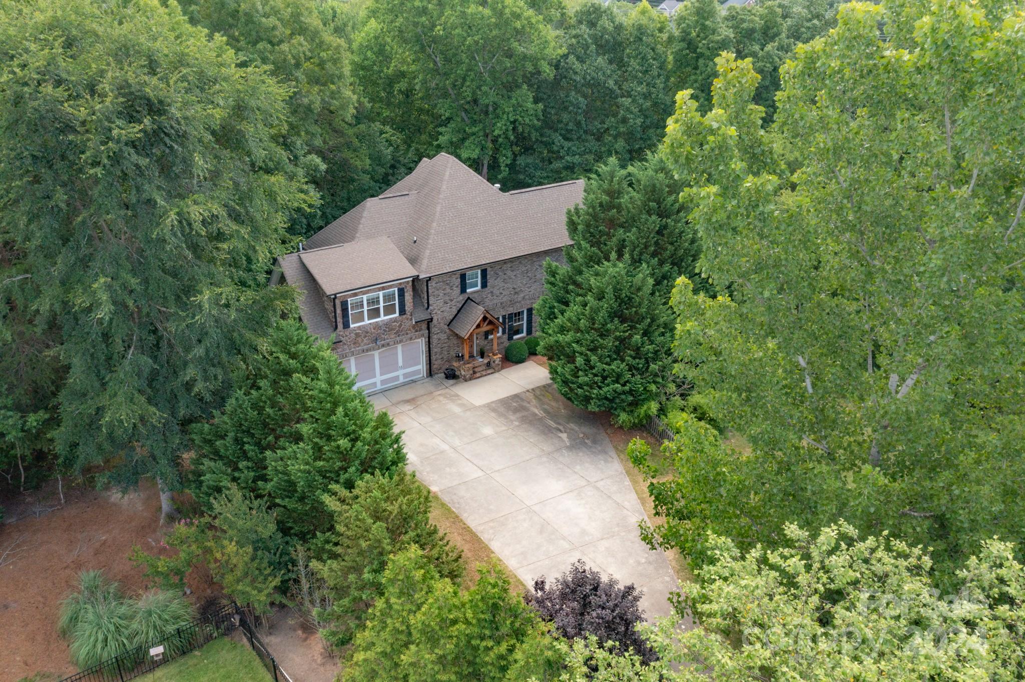 Sellers are highly motivated, schedule your viewing soon.  When they say location is everything, this is what they had in mind.  A rare find for any community this custom full-brick home has it all.   You will not find a lot location that gives you this much privacy.  Set back within the trees of Tega Cay golf course this home features a walk-out finished basement with its own entrance.  All three levels offer that unique ability to bring the outside in.  Tall ceilings throughout this 4 bed 3 1/2 bath home features an open floor plan with plenty of storage.  All piping has recently been replaced with PEX as well as one of the HVAC units. Over 400 sq ft of unfinished space in the basement.  Come see why all the neighbors refer to it as the treehouse of Lake Shore.  Located on the 15th hole of TCGC this home feels like you have your own acreage.  No HOA dues for this beautiful community.