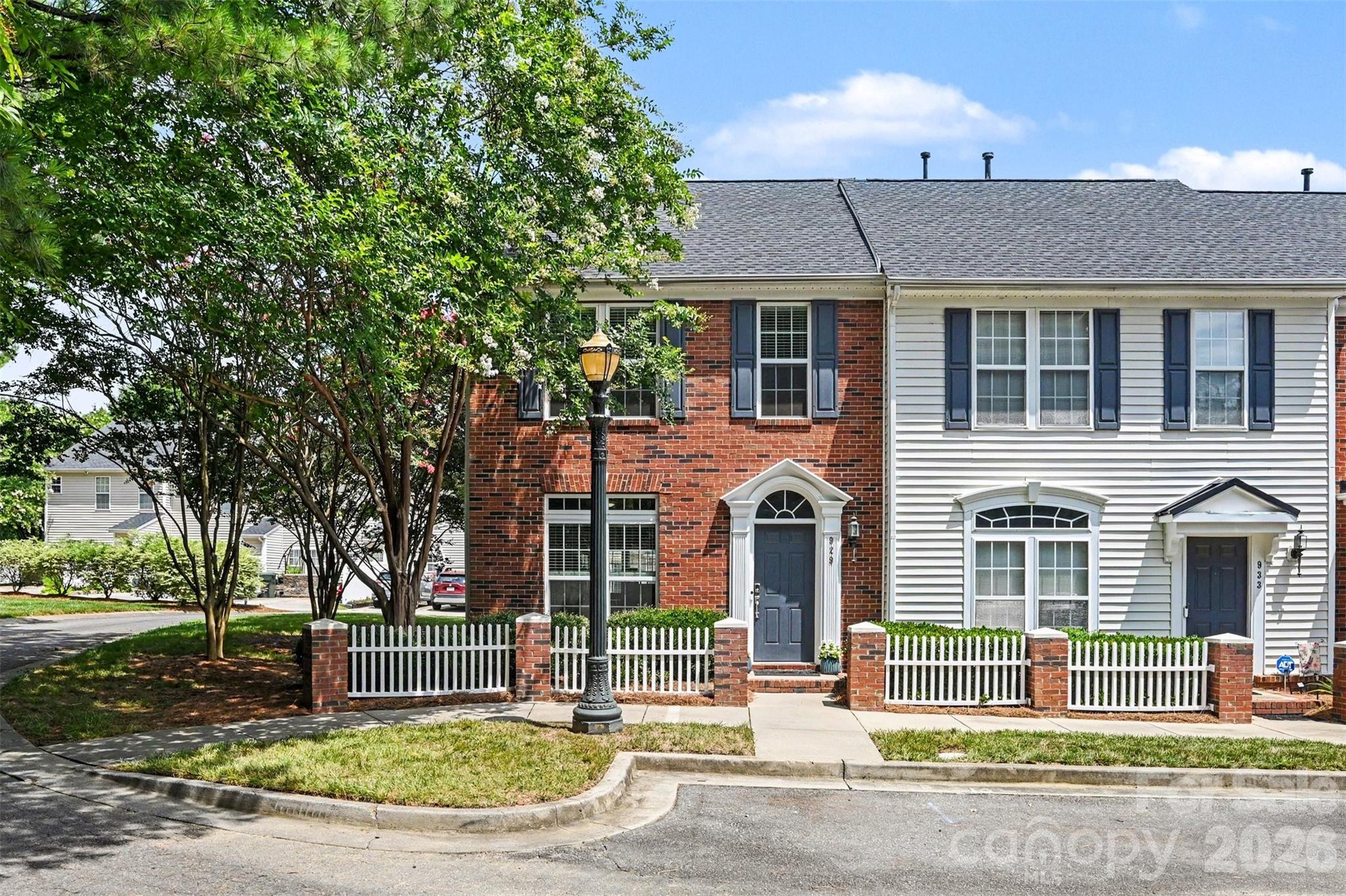 Beautifully updated and filled with natural light, this end-unit townhome offers the largest floorplan in the community, making it one you won't want to miss. Featuring 2 bedrooms and 2.5 bathrooms, this home combines comfort, style, and functionality in a highly desirable setting, with numerous recent improvements that make it easy to move in and enjoy from day one. Upon entry, you'll notice the thoughtfully designed living space showcasing expansive windows, updated flooring, and a spacious main living room. Unique to this floorplan is a versatile year-round sunroom, providing the perfect flex space for a home office, reading room, plant nook or fitness space. In the kitchen, you'll enjoy ample cabinetry, new hardware, all the appliances that convey, a breakfast bar with seating, as well as and a dedicated dining room. Upstairs, the spacious primary suite features an en-suite bath and generous walk-in closet, while the secondary bedroom also offers its own private full bath, creating an ideal layout for guests or roommates. Step outside to enjoy two dedicated rear parking spaces, an attached storage room, and your own built-in planter box, perfect for fresh herbs, seasonal flowers, or a small vegetable garden. Hosting is effortless with abundant street parking for family and friends. This home has been thoughtfully upgraded with all new windows (2025), updated foyer and hallway lighting (2025), new upstairs flooring (2024), all new toilets (2024), new bedroom ceiling fans (2024), updated door hardware throughout (2024), keyless entry (2024), new exterior storage door (2024), attic vent (2024), tankless water heater and new water lines (2021), and a new furnace (2022), allowing the next owner to move in with confidence. Residents enjoy a neighborhood pool, sidewalks, and streetlights, all while being just seconds from I-77, Target, HomeGoods, grocery stores, restaurants, and everyday conveniences. Only 30 minutes from Uptown Charlotte and Charlotte Douglas International Airport, this location offers the perfect balance of accessibility and neighborhood charm. Move-in ready and beautifully maintained, this exceptional end-unit is the one you've been waiting for.