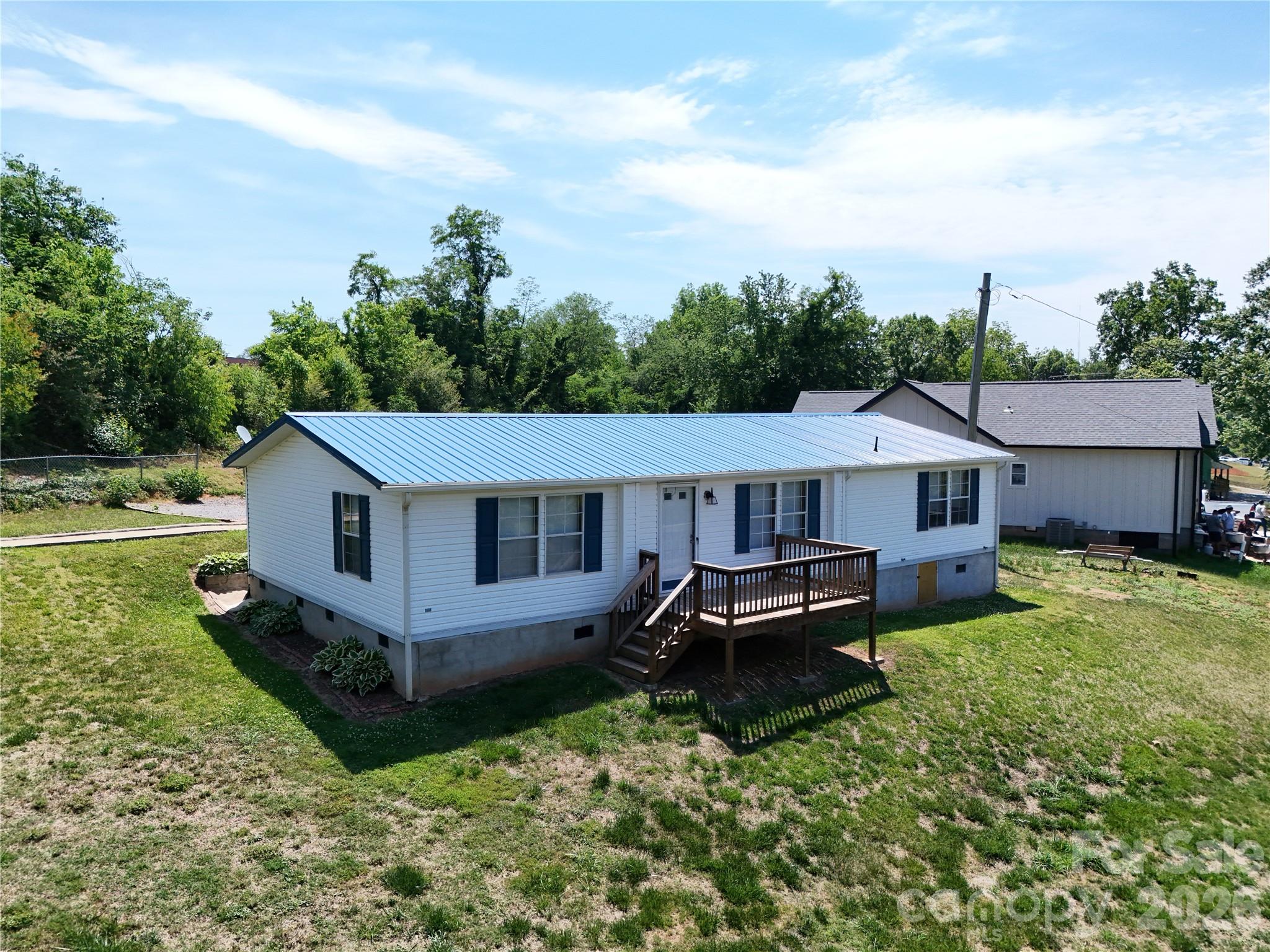 Welcome to a home that delivers comfort, space, and convenience all in one.

Featuring 3 bedrooms, 2 full bathrooms, and 1,456 sqft of well utilized living space, this property sits on a .26 acre lot just moments from the heart of Morganton, giving you the perfect balance of privacy and accessibility.

Step inside to find durable LVP flooring flowing throughout the main living areas, creating a clean, modern feel that is both stylish and low maintenance. The open living and dining space offers plenty of room to gather, while the kitchen stands out with an abundance of cabinetry, giving you all the storage you could need along with a functional layout that makes everyday living easy.

Both bathrooms have been tastefully updated with tile finishes, including a spacious walk in tiled shower and a separate soaking tub that adds a touch of comfort and relaxation.

Outside, the lot provides usable yard space with room to enjoy, entertain, or simply unwind, all while being just a short drive into town for dining, shopping, and everyday essentials.

If you have been looking for something move in ready, low maintenance, and close to everything Morganton has to offer, this one checks the boxes.