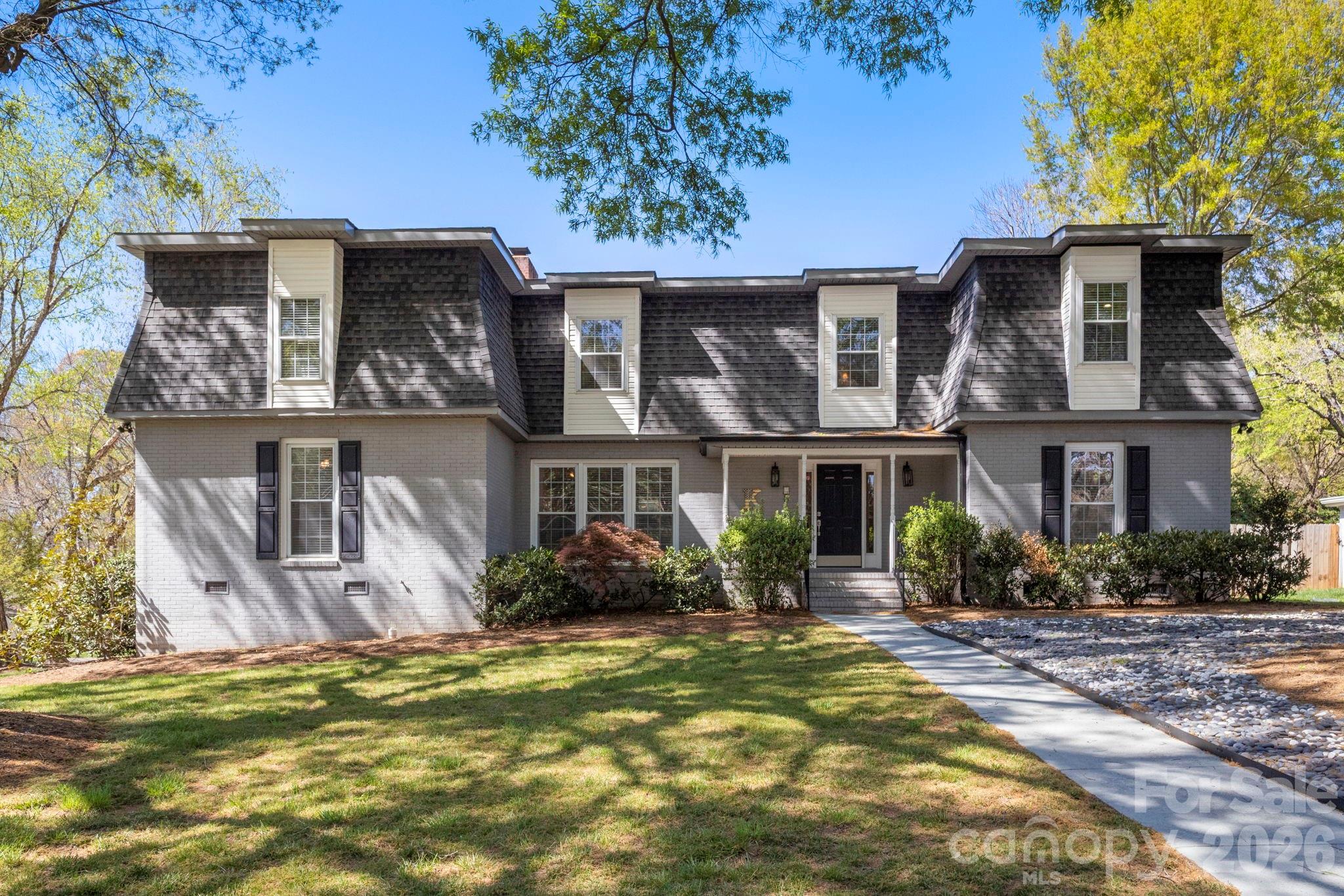 Welcome to 6116 Old Providence Road in one of Charlotte's much sought after neighborhoods! This four-bedroom home includes two large bedrooms downstairs (primary included) and an additional two bedrooms upstairs. Two bathrooms on main level and a third bathroom upstairs. This well-maintained home has an eat-in kitchen area as well as a computer/work desk space. In addition, the home's main level has a spacious den with built-in bookcases, formal living room, formal dining room and a beautiful entrance foyer with slate flooring. Just inside the back entrance is a large sunroom with wrap around glass windows with shades. In addition to the two well sized bedrooms upstairs, there is the full bathroom and a very large bonus room with endless possibilities for use! Upstairs area also includes spacious walk-in attic storage.
