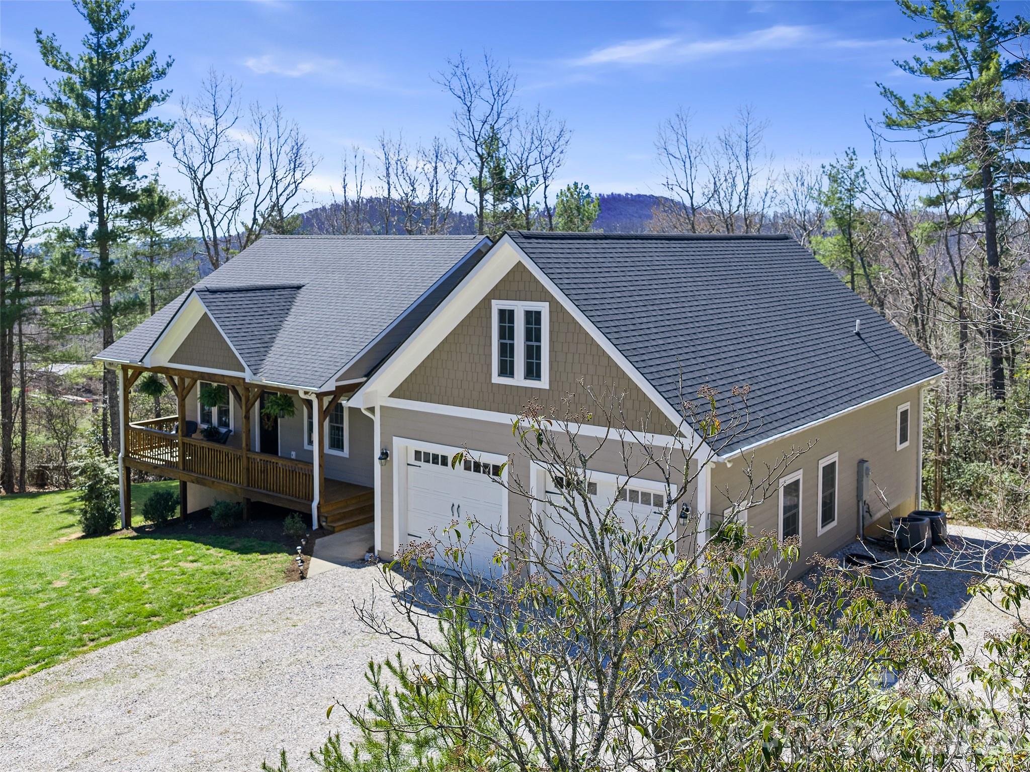 Ever wanted to live on the Blue Ridge Parkway? This home is the next best thing! Walking distance to the
Parkway, this move-in ready and impeccably maintained 3-bedroom, 3-bath home, built in 2019, is located in
the highly desirable Humpback Mountain area and offers amazing views. Featuring open-concept living on
both levels, the main floor provides convenient one-level living, while the lower level includes a
spacious family room, additional bedroom and bath, plus a workshop or multi-functional space with endless
possibilities and abundant storage. Step outside your door to nearly 400 acres of protected wilderness,
perfect for nature lovers and outdoor enthusiasts. This home combines modern comfort, thoughtful design,
and an unbeatable mountain setting—ideal for full-time living or a relaxing retreat