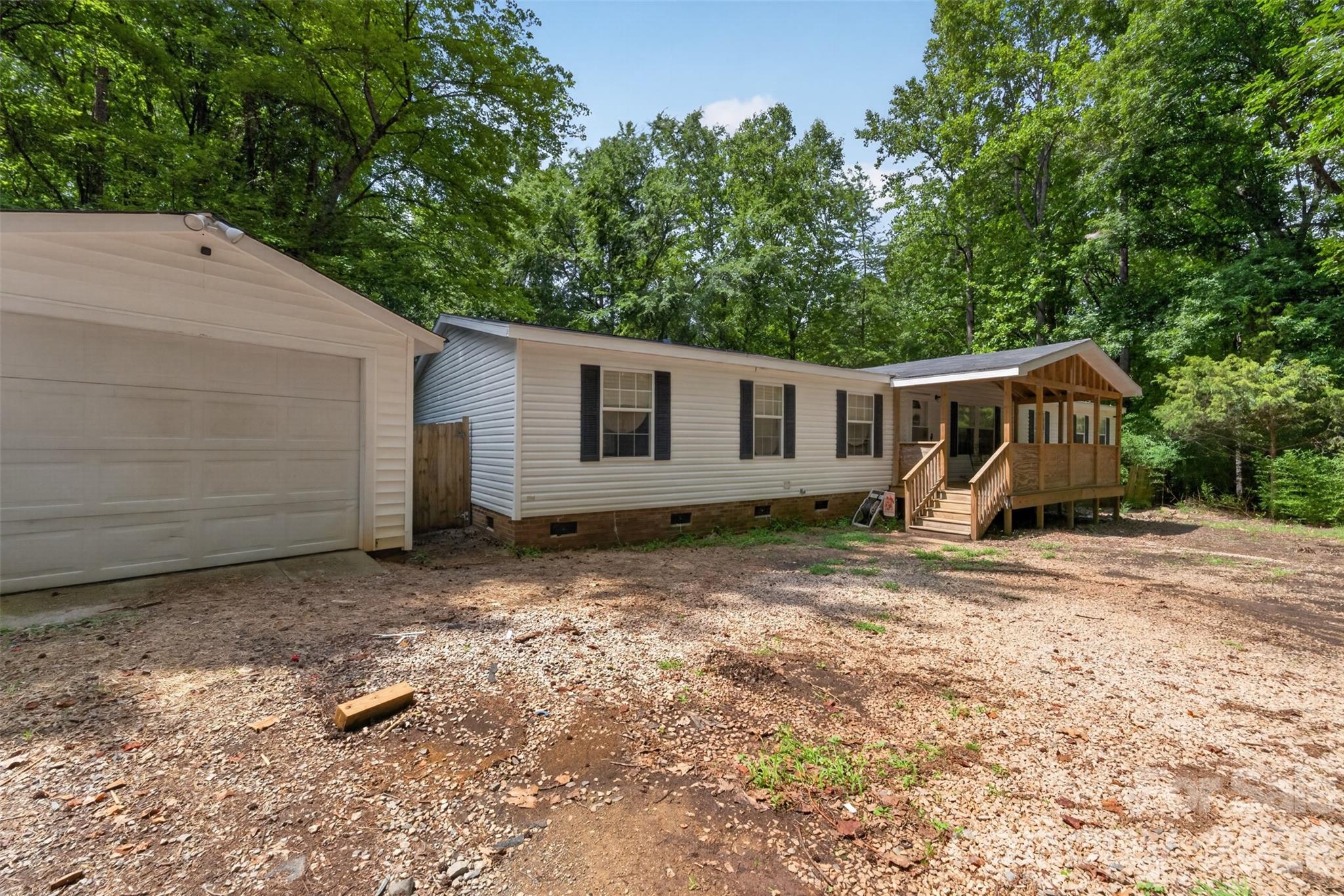 This well-maintained 4-bedroom, 2-bath manufactured home is situated on approximately 1.24 acres in Waxhaw and offers the perfect combination of space and functionality. The home features an open floor plan, a cozy fireplace, granite countertops, a brand-new stove, updated front and back porches, and a detached garage with an additional storage building, providing plenty of room for storage, hobbies, or a workshop. The roof was replaced in 2025.

Seller is offering up to $5,000 in buyer incentives with an acceptable offer, providing added value for qualified buyers. If you’re looking for peaceful country living with room to spread out while still being convenient to local shopping, dining, and everything Waxhaw has to offer, this property is a must-see.