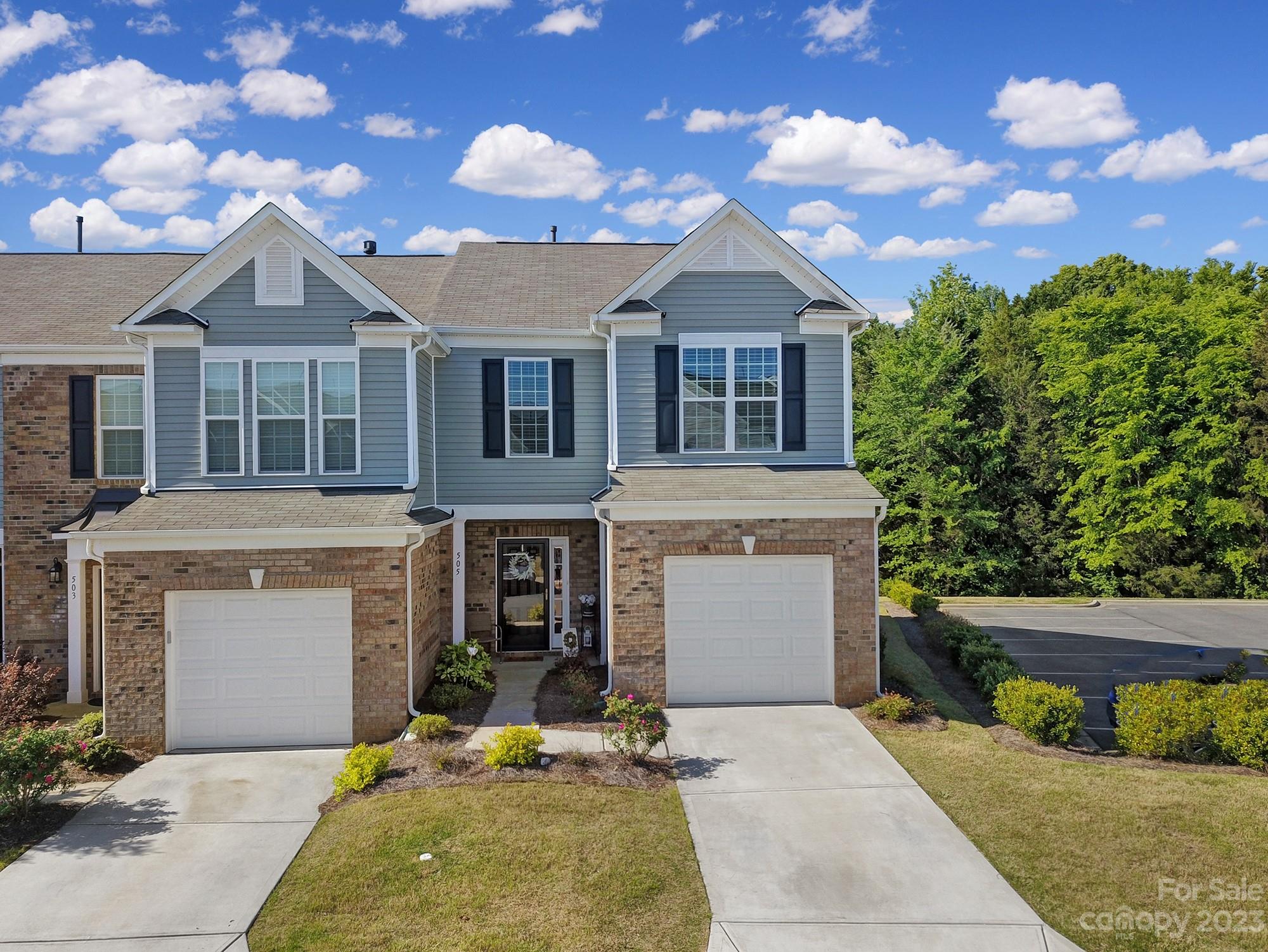 Immaculate end unit in gated Catawba Village neighborhood with a 1 car garage! 3 Bed, 2.5 Bath home shows like new & backs up to woods with privacy. Many upgrades that were available from the builder were done in this townhome! Kitchen features white cabinets, Quartz counters, subway tile backsplash, under cabinet lighting, and Stainless appliances. Open concept main living with dining area, living room that features a gas fireplace and a half bath. Upstairs are the three bedrooms, two bathrooms, and laundry. The primary bedroom is at the rear of the home and overlooks the private wooded lot with three large windows with en-suite bath that features large shower and double sinks. Catawba Village features a community pool, clubhouse and walking trails. This home is located next to parking area that makes it great for friends & family to visit! All of this conveniently located in Fort Mill school district but not far from I-77, Steele Creek, Carowinds, grocery store, shopping & more!