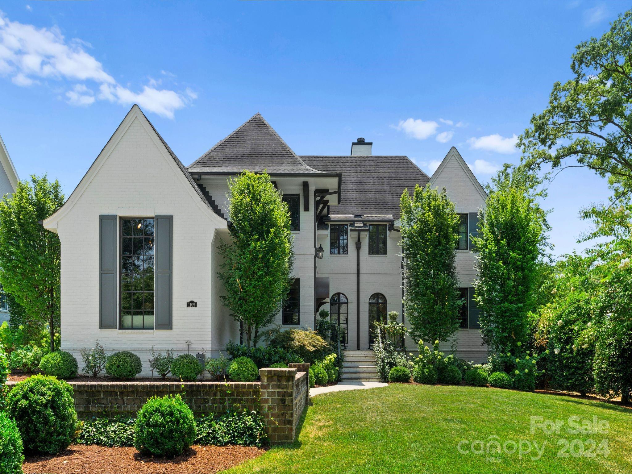 Exquisite home in desirable Myers Park! Completed in 2016, 1109 Ardsley features high end finishes, gorgeous windows, loads of light, open floor plan w/ 10 ft. ceilings. Elegant foyer w/designer wallpaper, spacious family room w/ custom built-in's, coffered ceiling & FP. Chef’s kitchen w/ marble countertops, Wolfe and Sub-Zero appliances. Main level study has a vaulted ship lapped ceiling. Gracious dining room. Primary suite on main w/ vaulted ceiling & impressive bathroom w/ soaking tub & oversized marble shower. Extensive moldings & hardwoods throughout. Upper level has 3 en-suite bedrooms. Bonus room w/ custom built-in's including a built in work space. Incredible outdoor living w/ a covered porch, FP, built in grill & green egg. Two car detached garage w/ EV charger (heated & cooled).  Extensive landscaping makes the flat backyard feel like a private oasis w/ invisible fencing, turfed lawn & putting green. Perfect in-town location minutes to uptown, shops and restaurants.