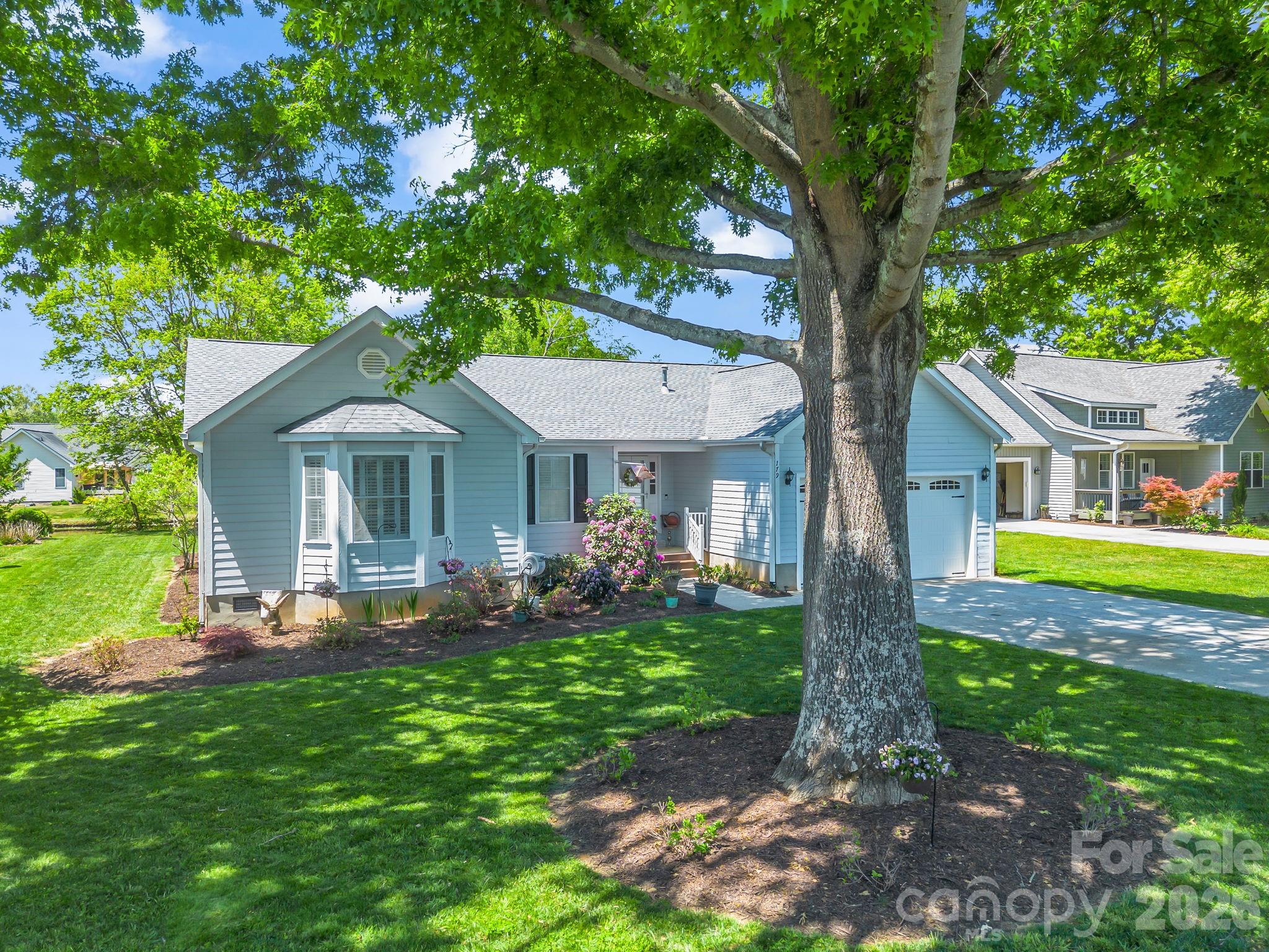 MILLS RIVER VILLAGE - Desirable location by the pond. Whole House Generator!  This spacious open floor plan features a heated and cooled sunroom and a screened porch in the back of the home, both of which offer lovely views of the pond. It is move-in ready since the current owner has updated all appliances, added a half bath, updated the flooring, countertops, and backsplash, replaced the AC and heating furnace, installed a shower in the primary suite, added a stack washer/dryer in the bath, added a generator, improved the landscaping, expanded the deck, encapsulated the crawl space with a dehumidifier, and added a split unit in the sun room. Sun Room has expansive windows overlooking the water, featuring tile flooring and dedicated heating and cooling for year-round enjoyment but not included in square footage.  Residents enjoy living in Mills River Village. It is conveniently located near major grocery stores, restaurants, breweries, schools, shopping, and Mills River Park. You will find everything you need nearby. Access to Hendersonville, Brevard, the airport, Arden-Fletcher, and major highways like I-26 makes commuting easy. Living in Mills River, NC, is wonderful!