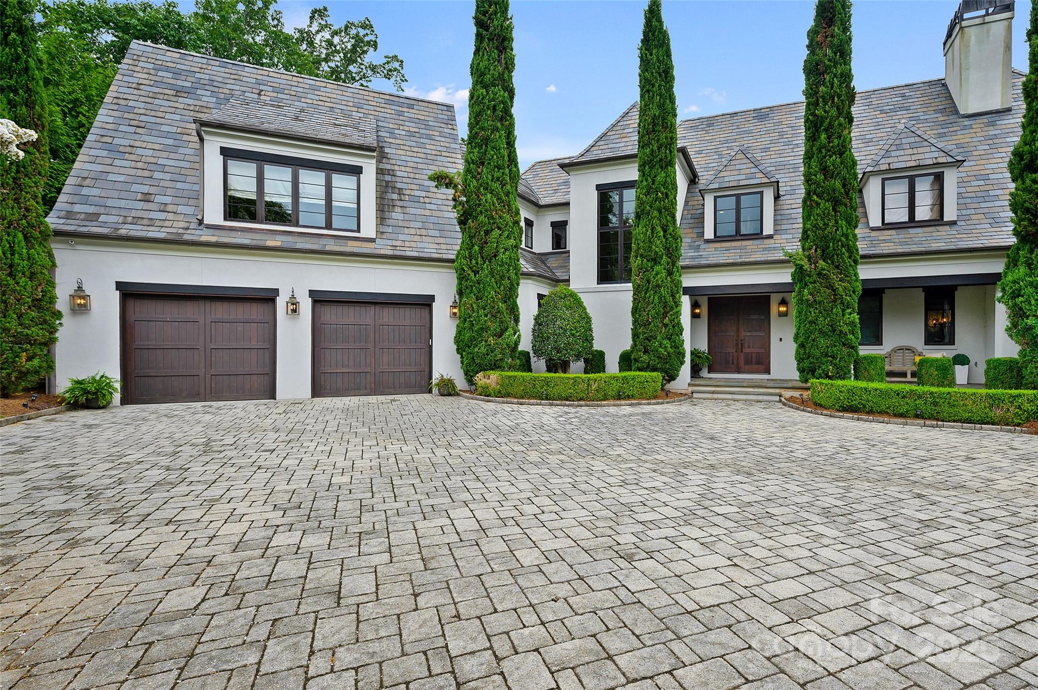 Notable Classic  Custom by Arcadia Homes! Incredible Home site with Panoramic Golf & Water Views! RESORT LIVING AT ITS FINEST!  Salt Water  Pool with Spa, Vaulted Summer Porch, With Built in Grilling - Travertine Marble Terrace --  Ideal for Entertaining. Don't miss - Fire Pit! Elegant Formals PLUS Chef's Kitchen w/ Expansive Center Island, SS appliances, Scullery, Sun filled Breakfast Opens to Vaulted Keeping Room with Beam-Ceiling & Fireplace. Primary Retreat on Main w/ Custom Walk in Closets. Luxurious Marble Bath & MORE. Upper Level Offers 4 En Suite Bedrooms PLUS Bonus & 2nd Laundry. Lower Level Offers Private Guest Retreat, 2nd Garage, Wine Cellar, Bar, Exercise, Walk in Storage- Private Office, AND Pool Bath  ELEVATOR Services All 3 levels! Incredible Designer Features Inside & Out! 
 An Amazing Opportunity in Popular Ballantyne Country Club. Conveniently located in the Heart of Ballantyne, with all of its Wonderful  Amenities! WELCOME HOME!